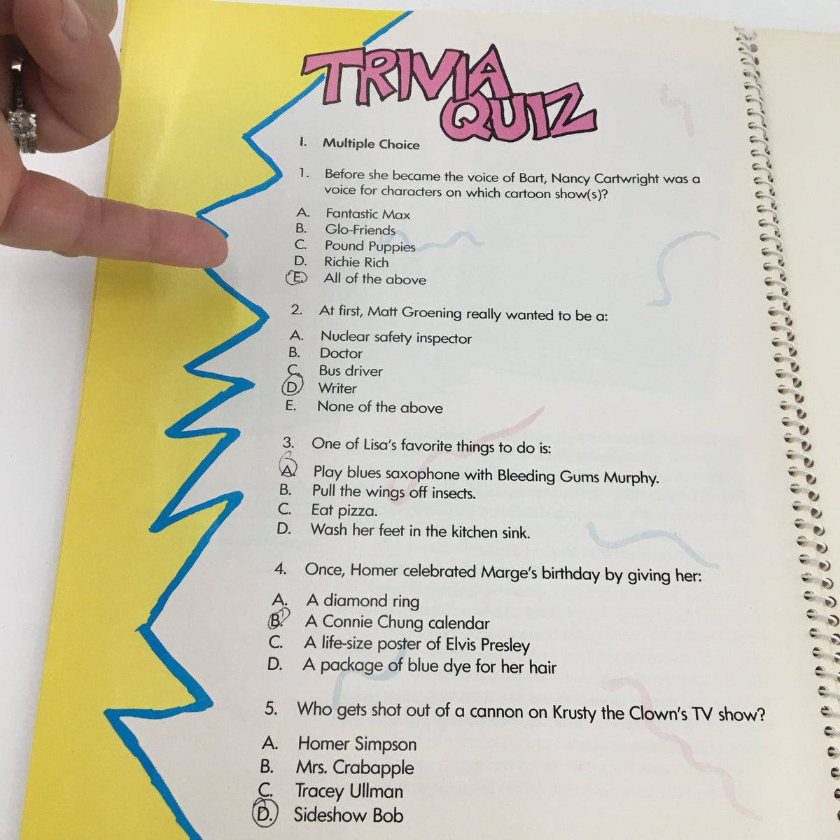 Trivia quiz page from '1990 Consumer Guide Presents Simpson Mania The History of TV's First Family,' engaging readers with questions about the beloved characters and episodes.