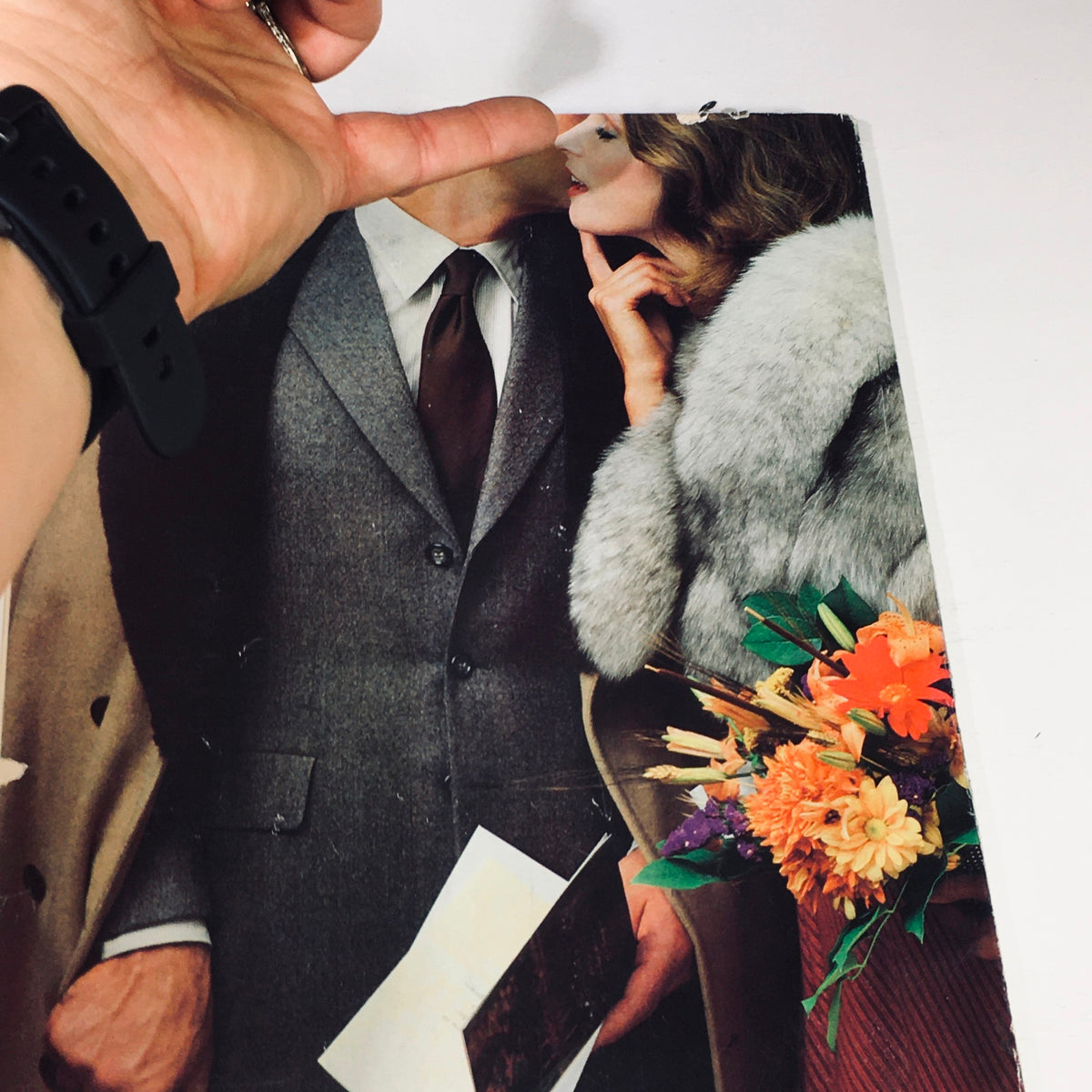 Close-up of hands holding a magazine page of Philadelphia Magazine November 1980 - The New Chinese Restaurants, featuring a gentleman in a suit.