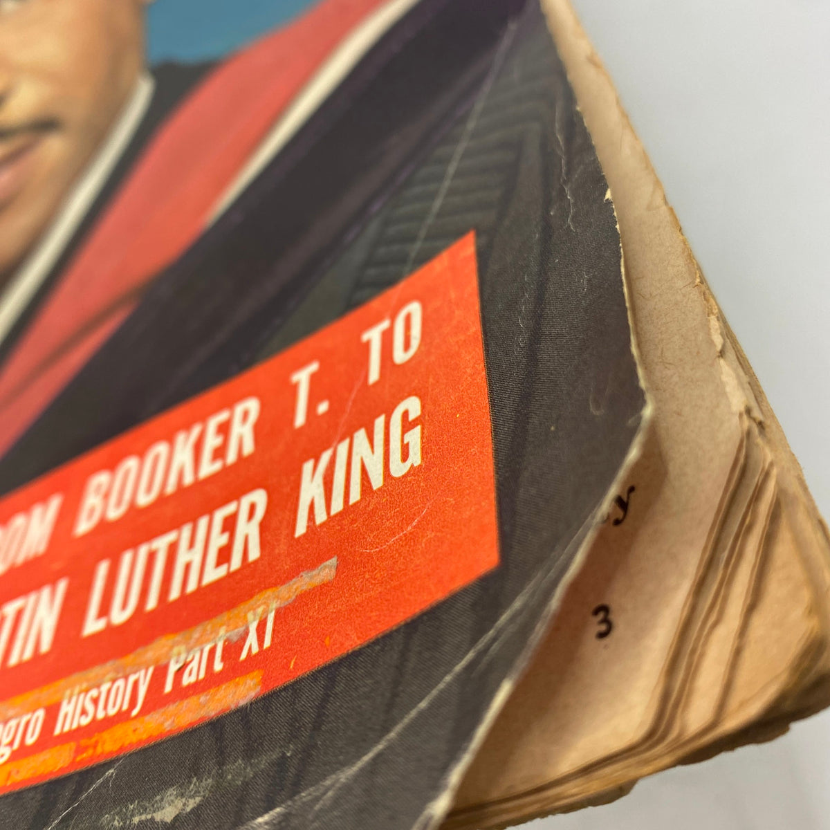 Close-up of the Vintage Ebony Magazine November 1962 Vol 18 No. 1 cover, featuring a torn edge and details about Martin Luther King Jr.