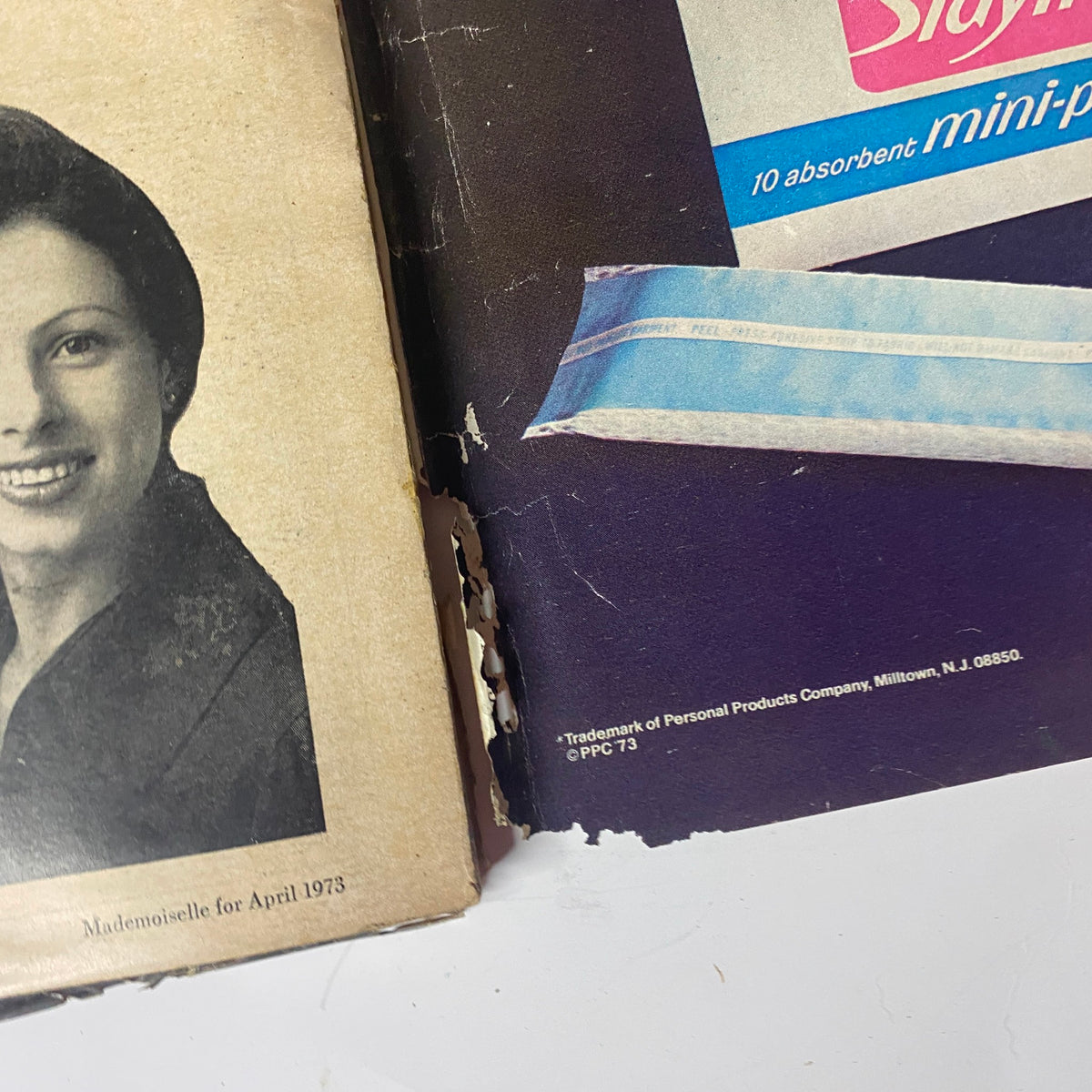Back cover of Mademoiselle Magazine April 1973 featuring an ad for Max Factor's Pure Magic Super Clear Make-Up, emphasizing natural beauty.