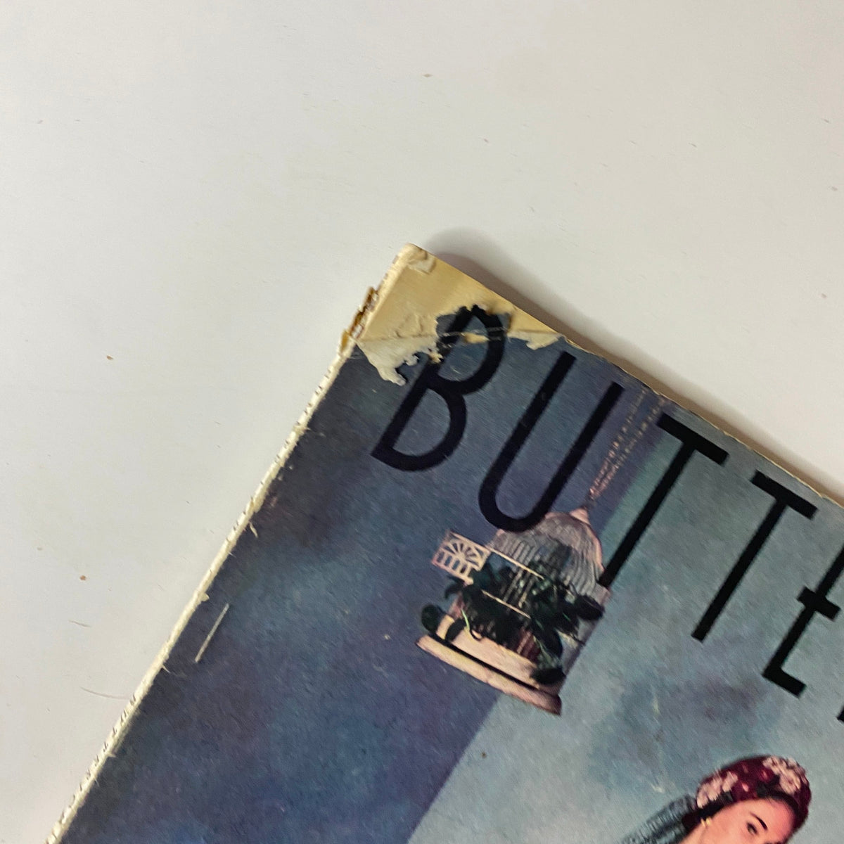 Close-up of the top section of the 1948 Butterick Spring and Summer Pattern Book Catalog cover with emphasis on the title 'BUTTERICK' and the fashion illustration.