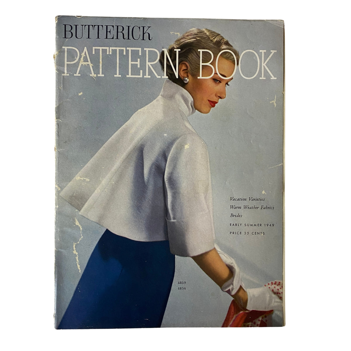 Cover of the 1949 Butterick Early Summer Pattern Book featuring a model in a stylish outfit, showcasing the fashion from the era.