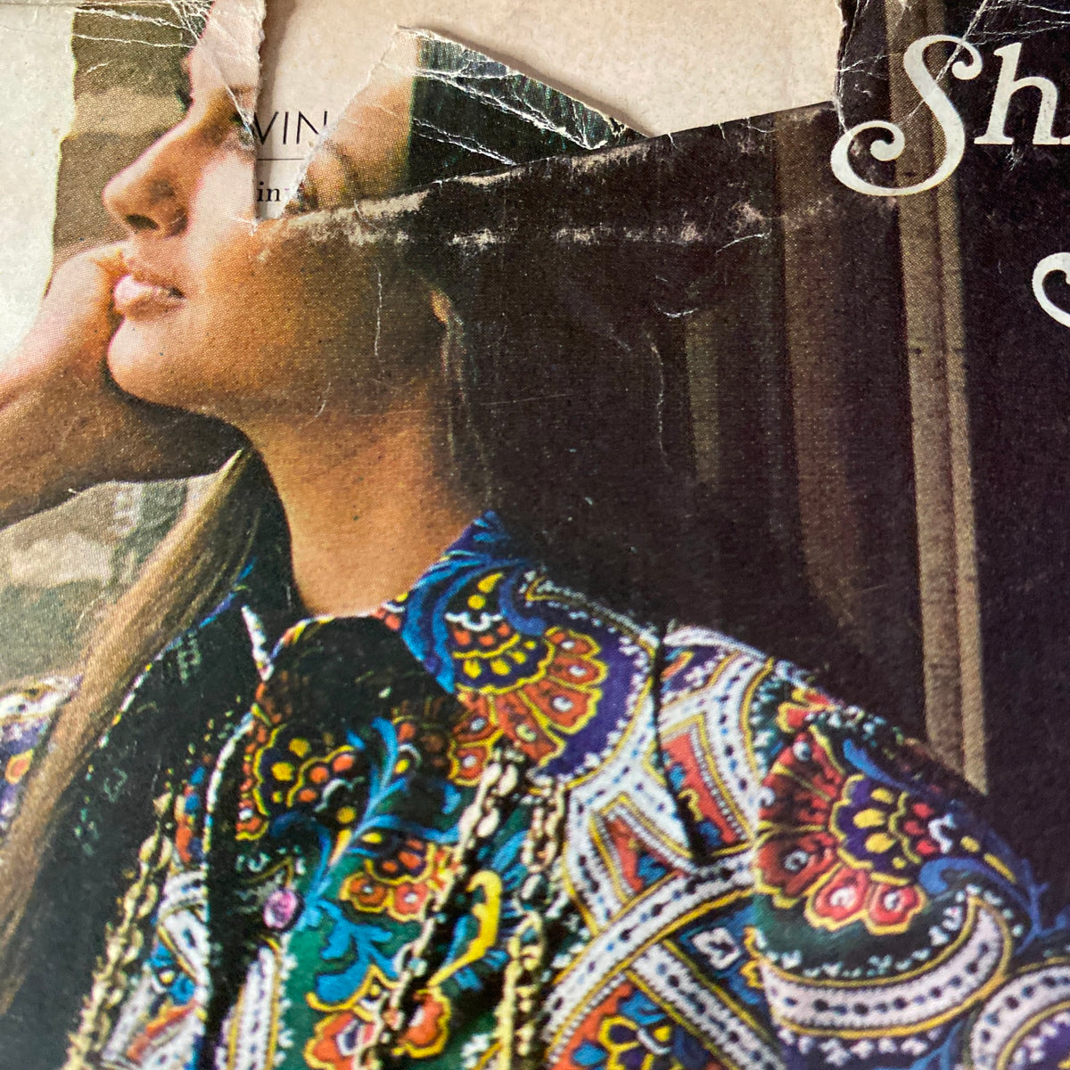 Close-up of the Vogue Magazine September 1, 1971 cover featuring Patricia Dow, highlighting her stylish patterned blouse and hair, with visible damage on the top left corner.