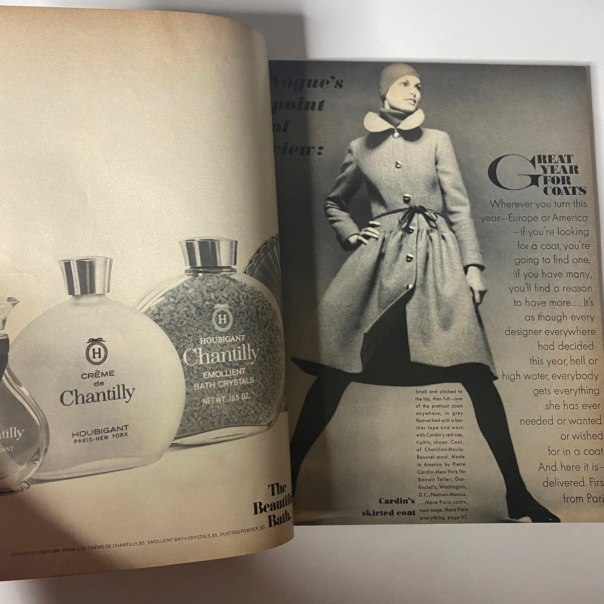 Opened spread from Vogue Magazine September 15, 1971 showcasing advertisements for luxury products and featuring a model wearing a stylish coat.