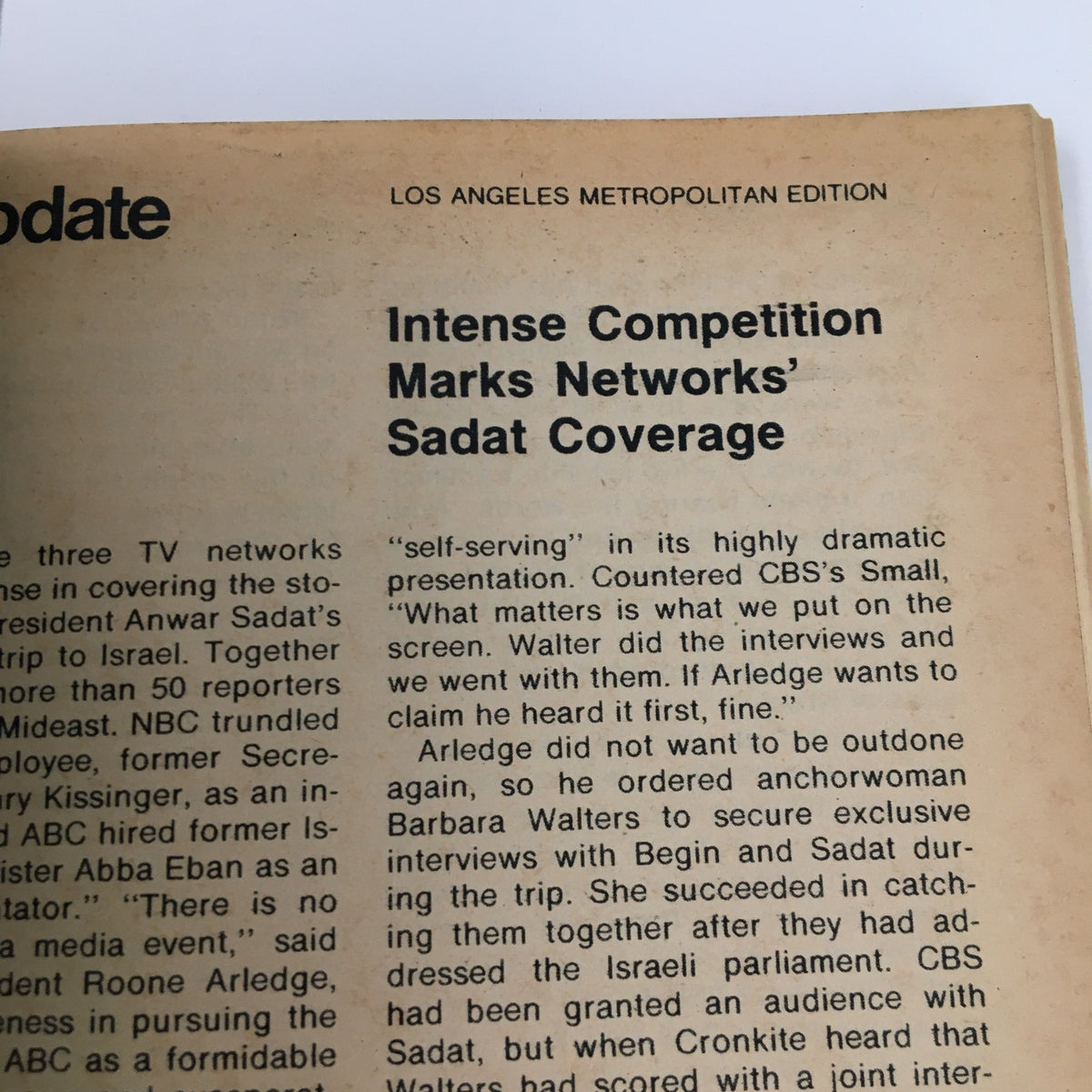 Another interior page of TV Guide Magazine December 3, 1977, showing an article discussing networks' coverage of Sadat with the title 'Intense Competition Marks Networks' Sadat Coverage.' This insight contributes to the context of TV broadcasting during the era.