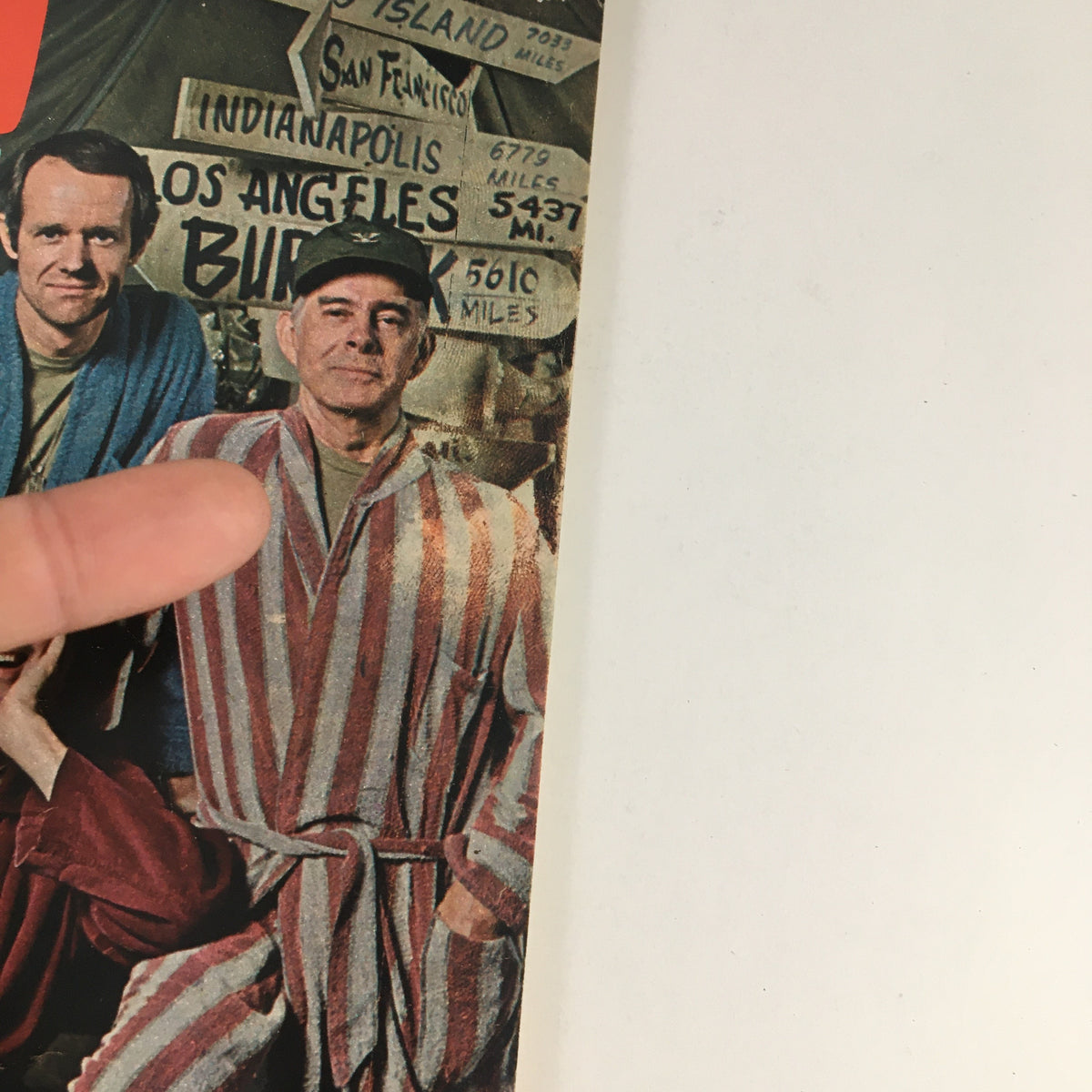 Close-up of the TV Guide cover from January 24, 1976, highlighting Alan Alda, Mike Farrell, and Harry Morgan, with a vintage aesthetic.