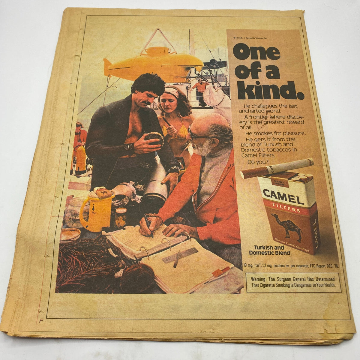 VTG Gig The Music Magazine July 1977 displaying a vintage advertisement for Camel Filters featuring a diver and a captain on a boat.