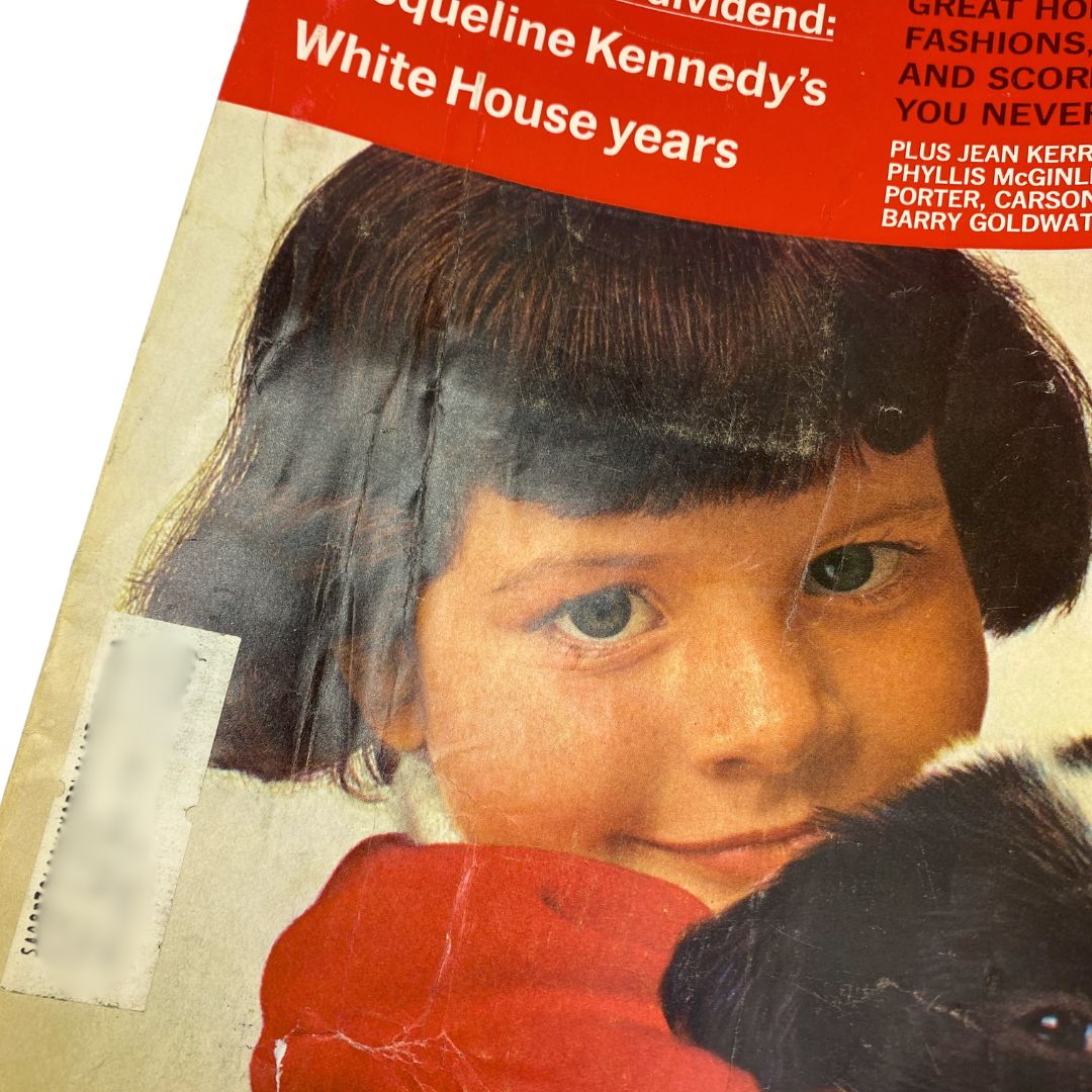 Close-up of VTG McCall's Magazine December 1967 cover featuring a child with a puppy, emphasizing the title 'Jacqueline Kennedy's White House Years'.