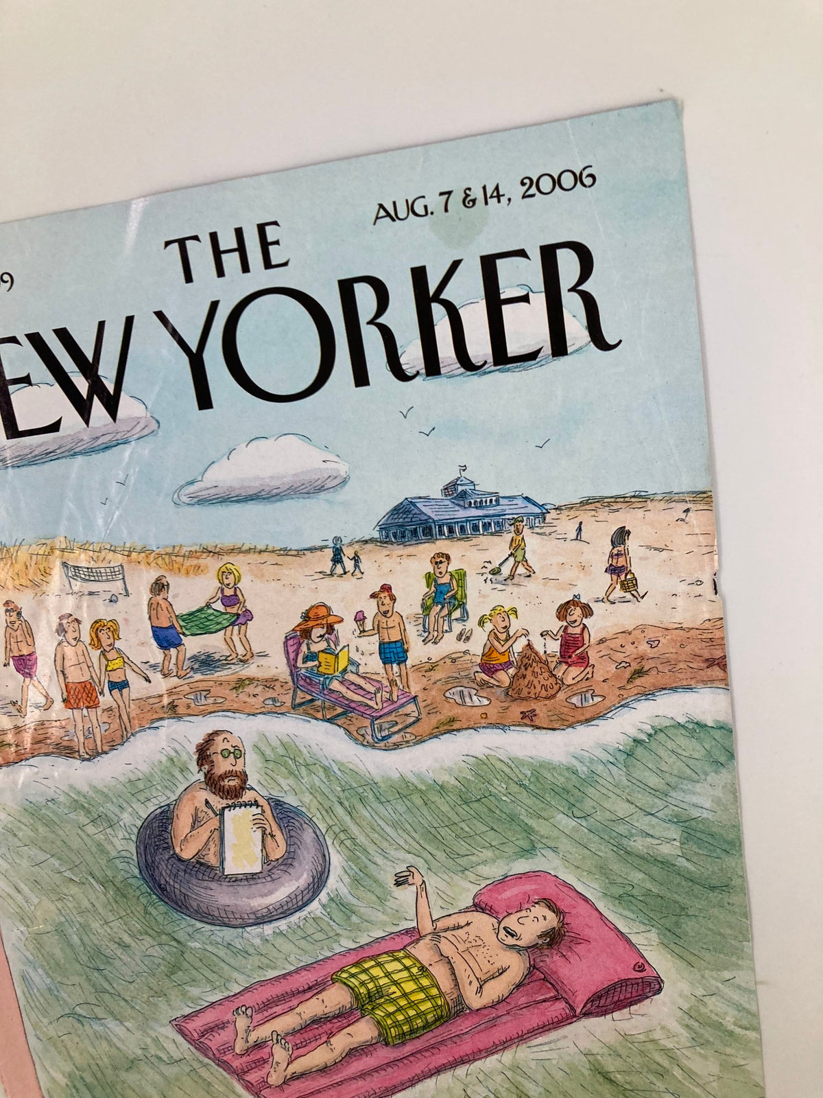Detail of The New Yorker cover from August 7 2006 titled 'Emergency Session' by Roz Chast, highlighting a beach setting with a man on a float and beachgoers in the background.