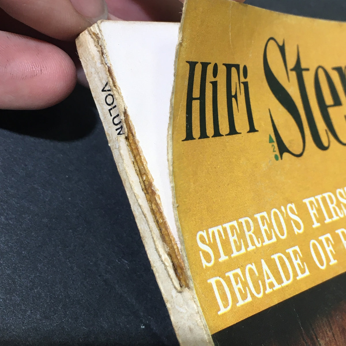 Close-up of the spine of the VTG HiFi Stereo Review Magazine February 1968, revealing its title and showing signs of wear, signifying its vintage value.
