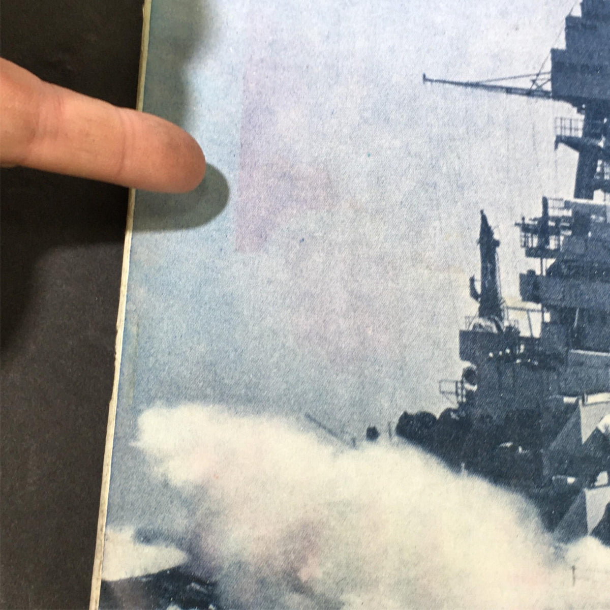 Close-up view of the cover of the Vintage Literary Digest Magazine from July 15, 1933, highlighting the battleship and water splashes, associated with the theme 'The New Deal and The Navy'.