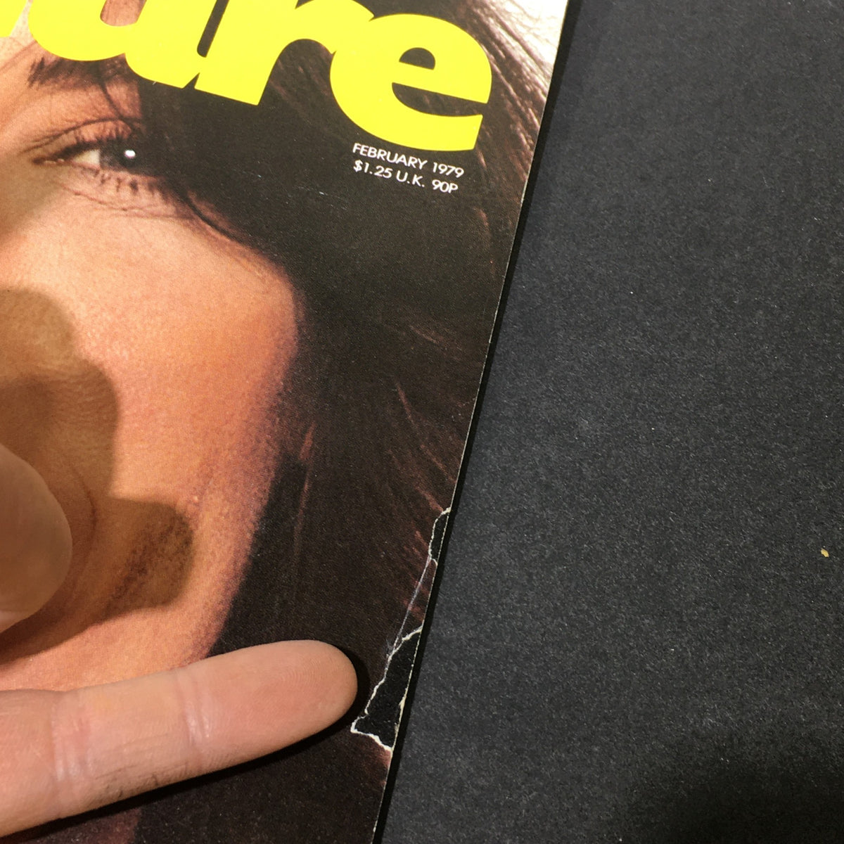 Close-up view of the VTG Crawdaddy Feature Magazine February 1979 cover, highlighting a small tear and details of Lily Tomlin's feature article by Robert Ward.