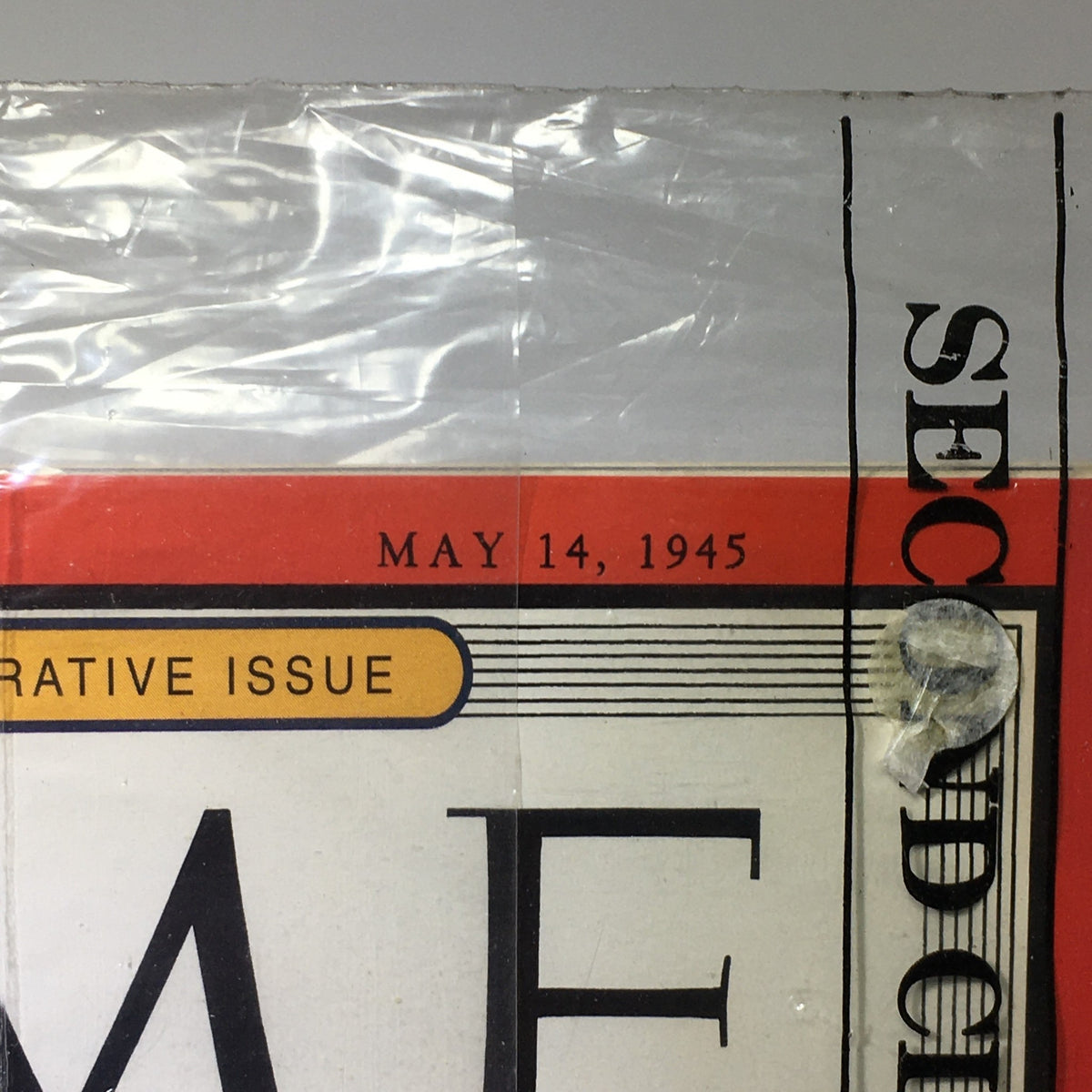 Close-up view of the May 14, 1945 edition of Time Magazine featuring 'The Big Three' title and a plastic cover, showcasing its historic significance as a collectible item.