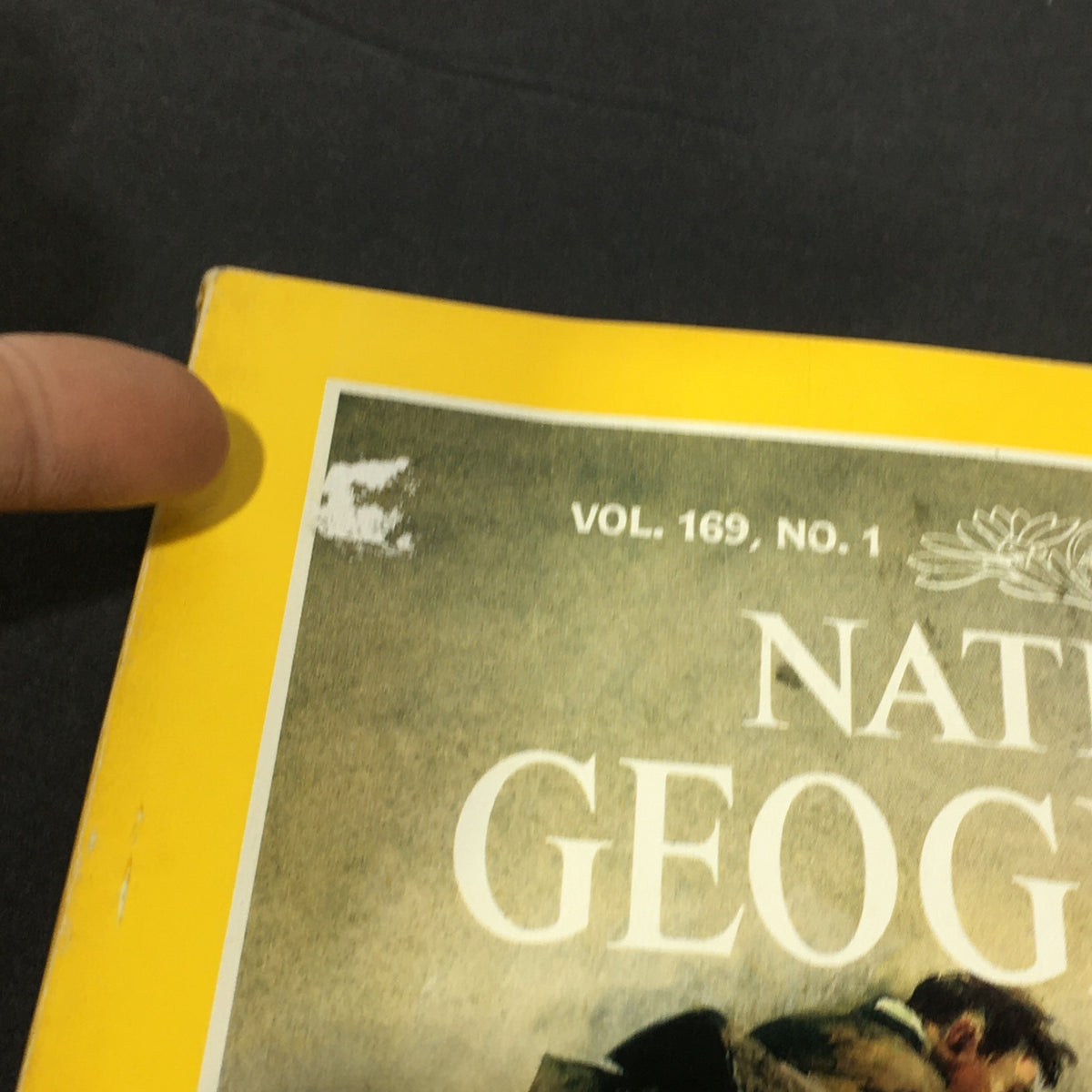 Close-up of the top of the National Geographic Magazine cover from January 1986, highlighting the title and volume information, featuring Charley Russell, Cowboy Artist.