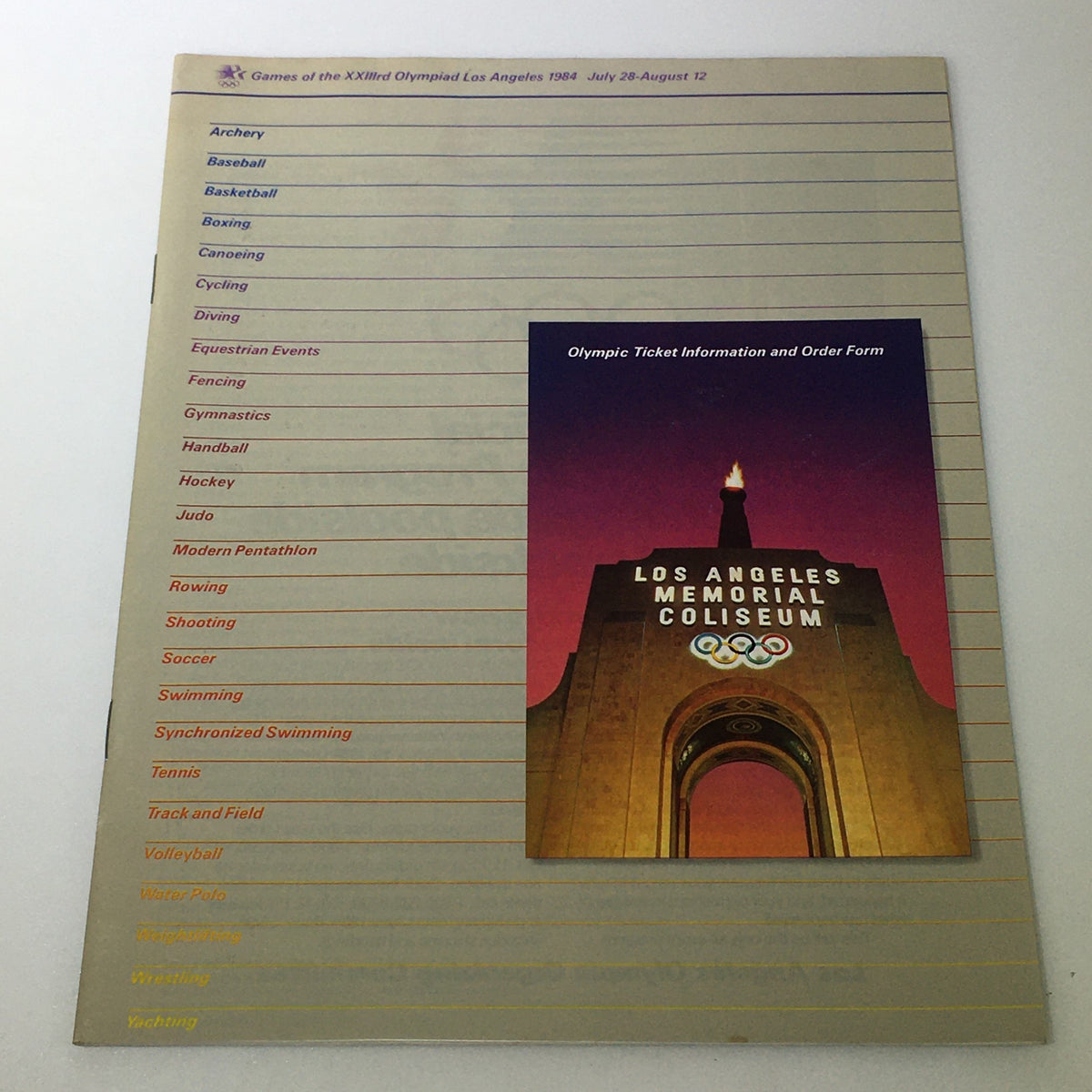 Front cover of the VTG Official 1984 Ticket Order Form for the Games of the XXIIIrd Olympiad, Los Angeles, featuring the Los Angeles Memorial Coliseum and a list of Olympic events.