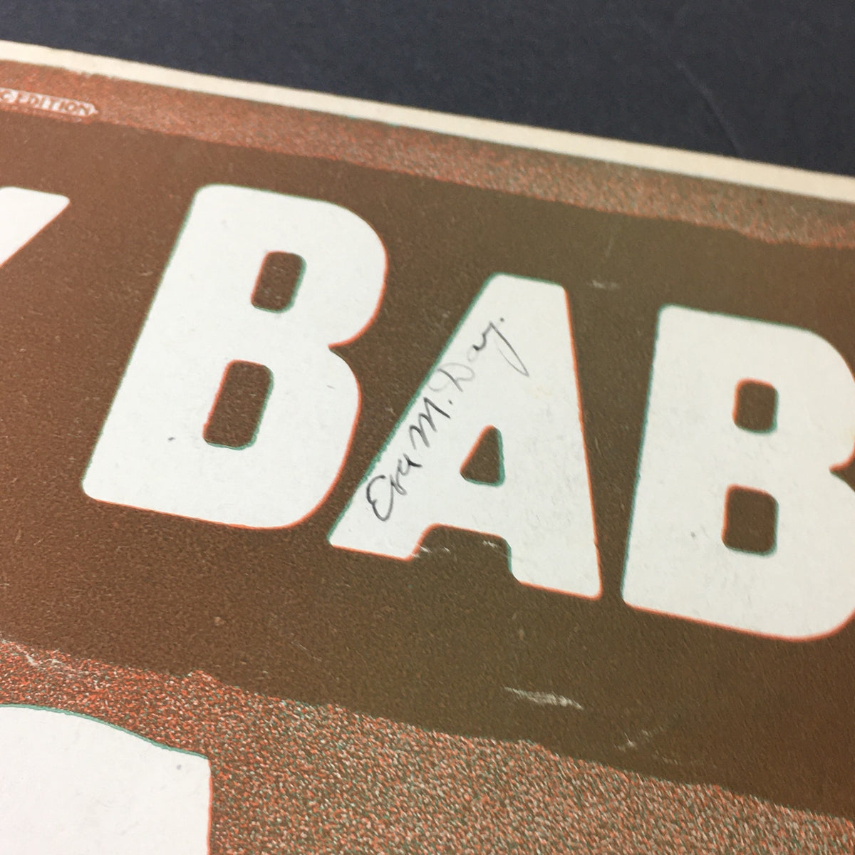 Close-up of the Pretty Baby song sheet showing handwritten notation, with visible title and details of the design, music by Tony Jackson.