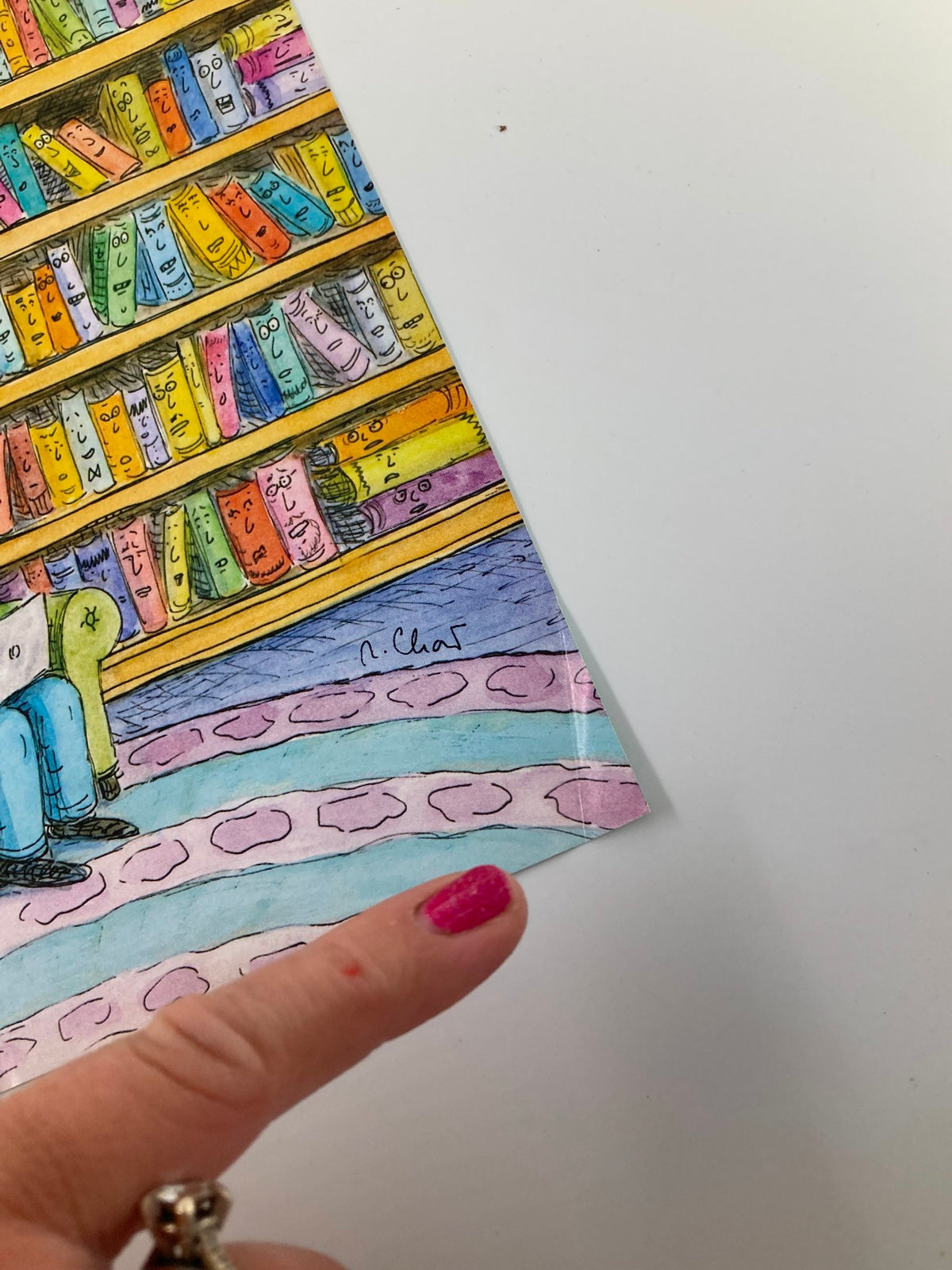 Close-up of the corner of The New Yorker October 18 2010 cover illustrated by Roz Chast, showing the signature and detail of the colorful book design.