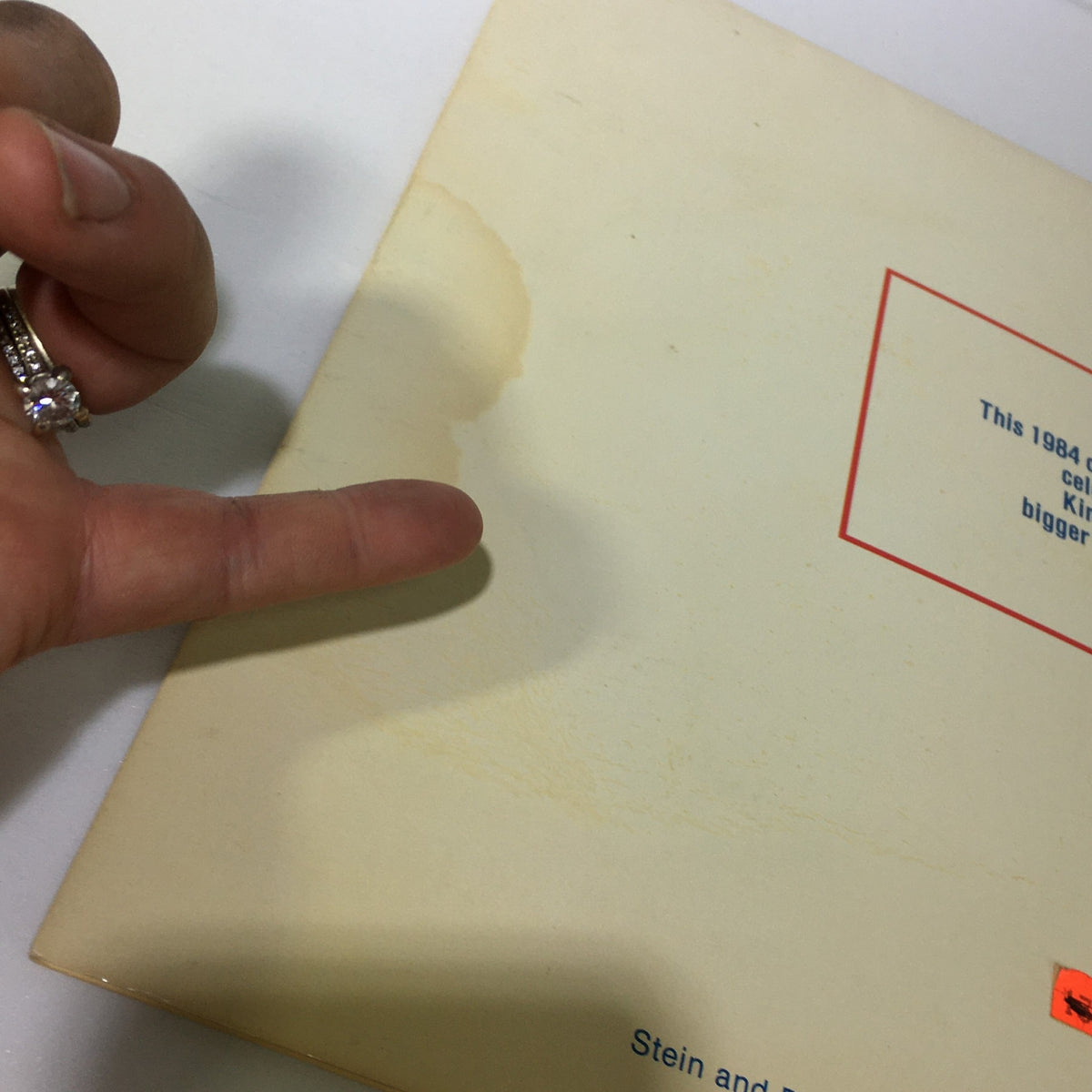 Detail of the back cover of the 1984 Elvis Presley's Love Me Tender & Birthplace Graceland Photo Calendar, showing a moisture mark on the surface.