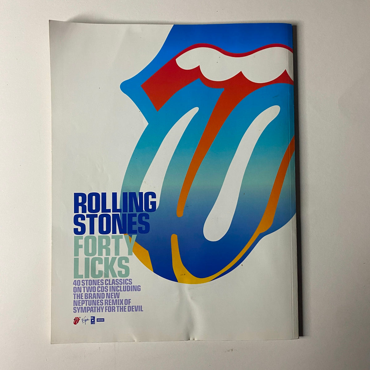 Cover of NME Originals Magazine Vol 1 Issue 9 showcasing the iconic Rolling Stones tongue logo and promoting the 'Forty Licks' collection, a testament to their musical legacy.