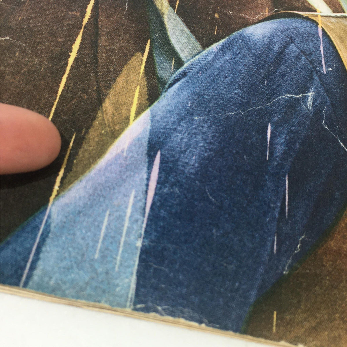 Detailed view of the cover of VTG The Saturday Evening Post, December 4, 1965, focusing on edge and texture damage.