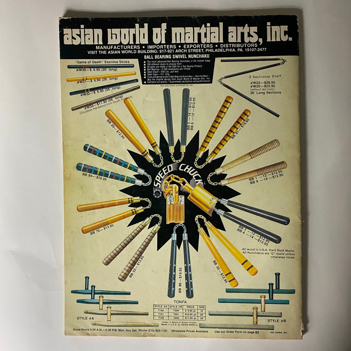 Back cover of the VTG Karate Illustrated Magazine Yearbook 1983 showcasing various martial arts equipment from Asian World of Martial Arts, including nunchaku and tonfa.
