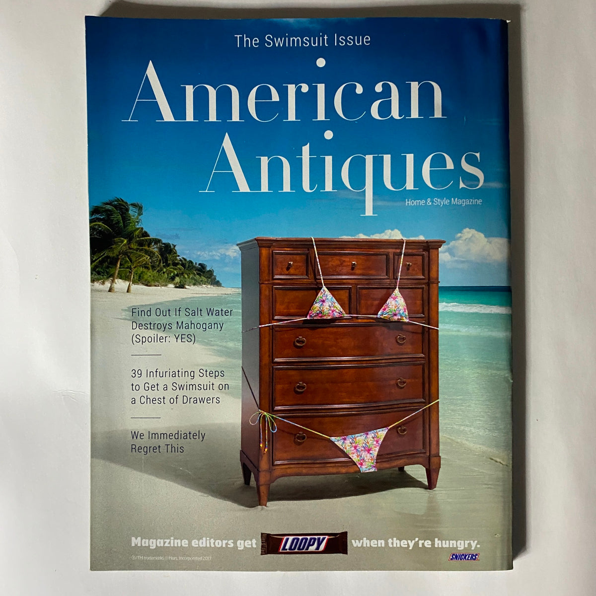 Cover of American Antiques magazine themed around swimsuits, reflecting the cultural significance of swimwear from the perspective of vintage style and fashion.