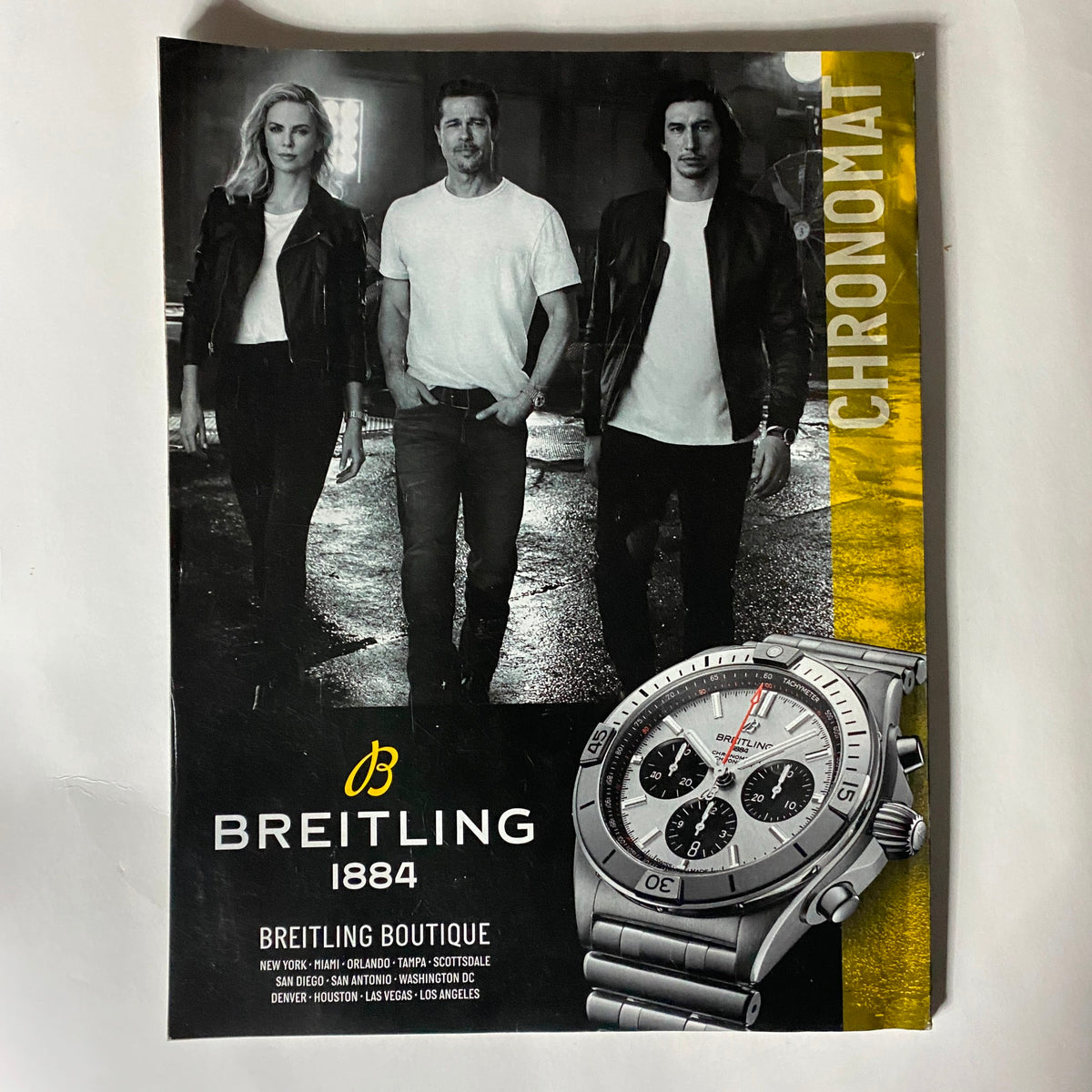 Cover of Breitling 1884 catalog with featured models showcasing luxury watches, themed 'Chronomat', emphasizing elegance and style related to the Sports Illustrated Magazine 2020.