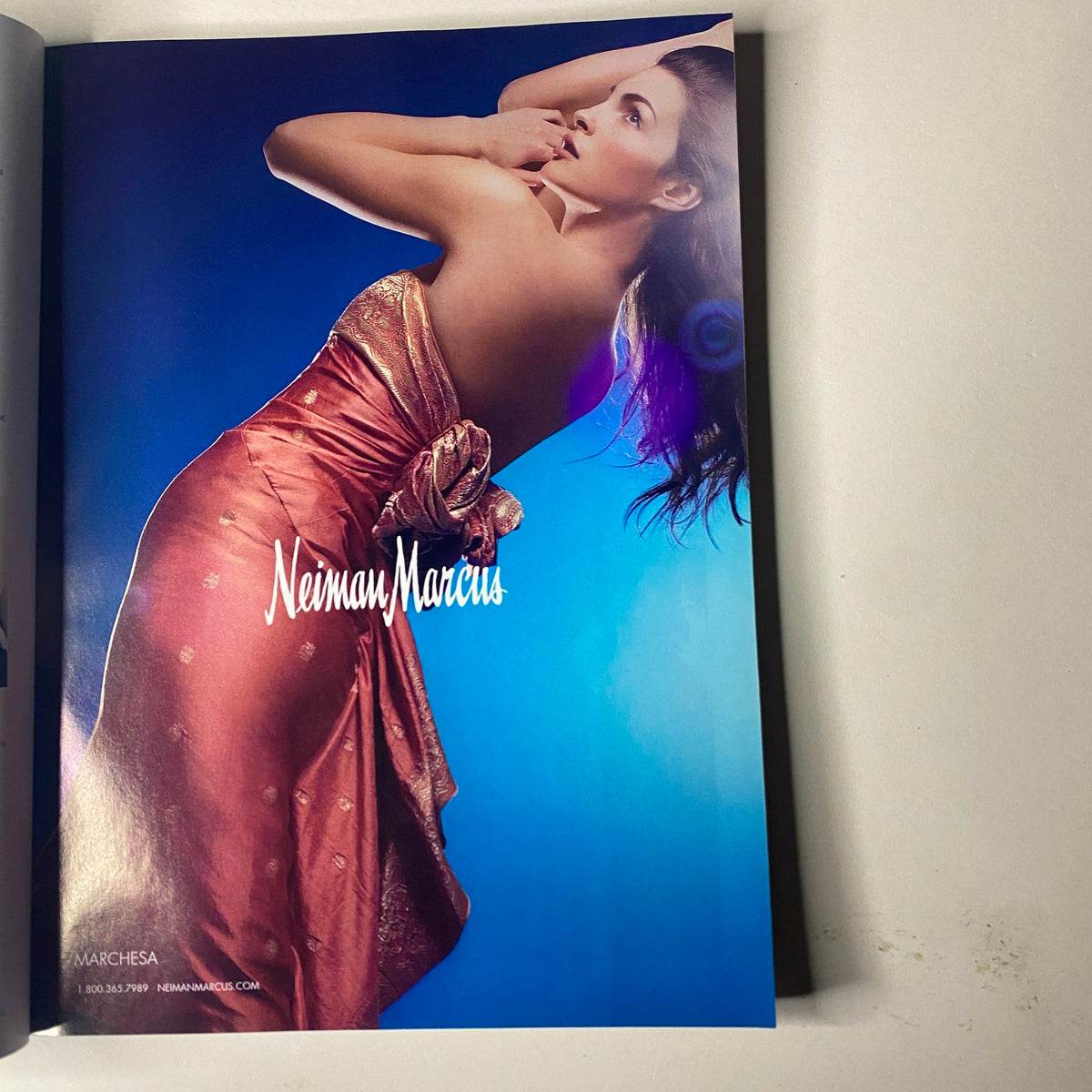 Advertisement page in Vogue Magazine May 2006 for Neiman Marcus, showcasing elegant fashion designs that complement the issue's high-fashion theme.