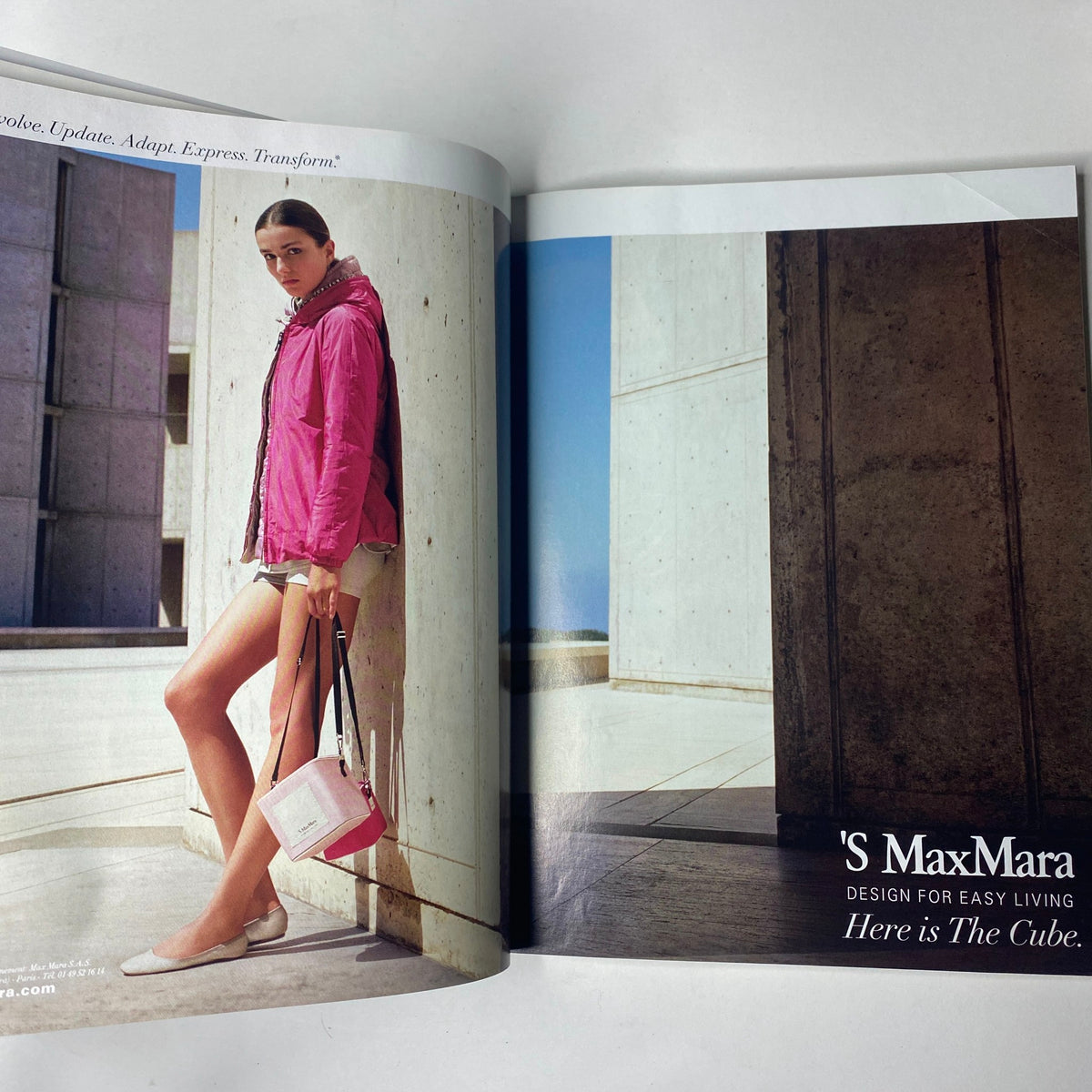 Vogue Paris Magazine February 2013 No. 934 includes a fashion spread featuring 'S MaxMara, highlighting a stylish model in a pink jacket paired with shorts, set against a modern architectural backdrop.