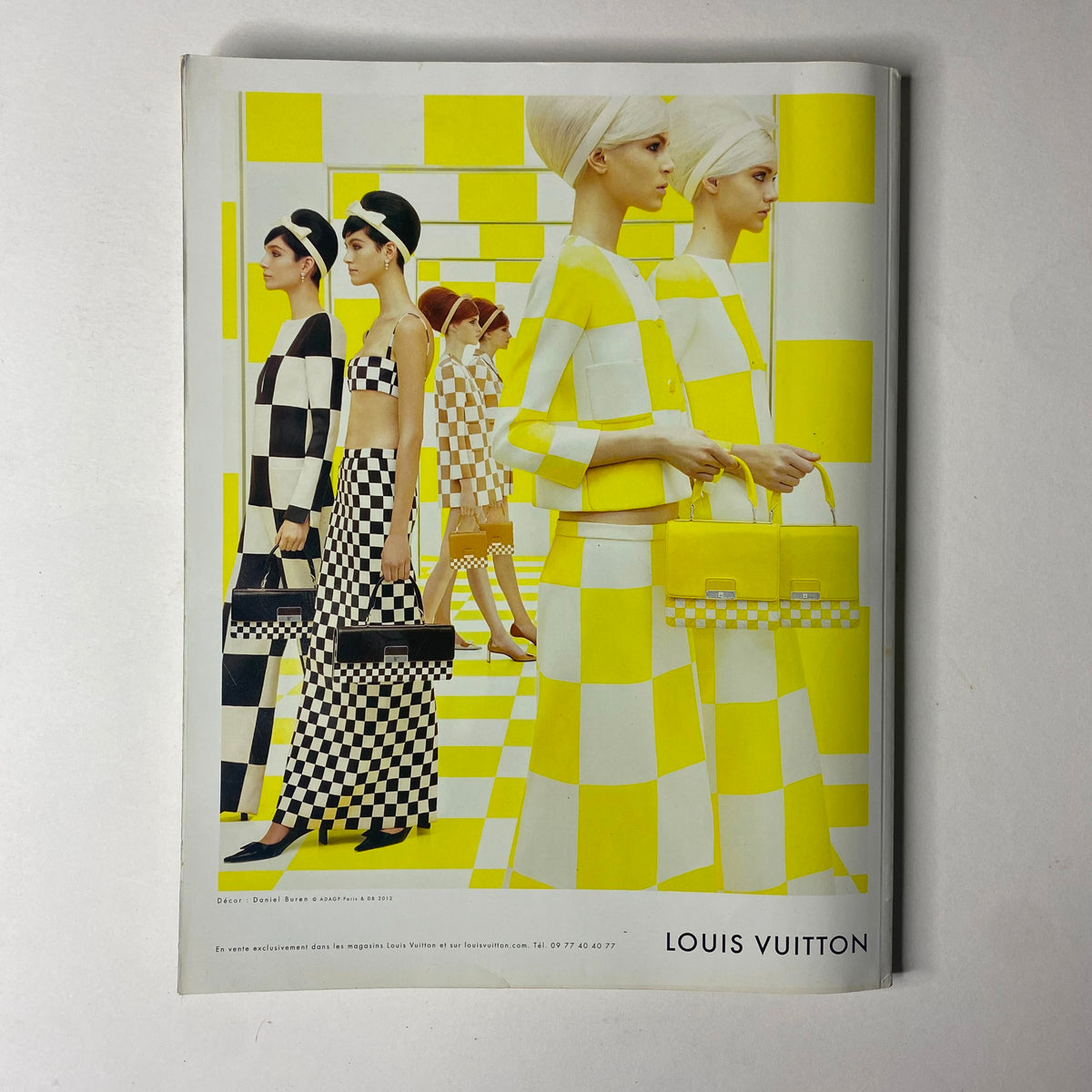 Vogue Paris Magazine February 2013 No. 934 features a striking Louis Vuitton advertisement, showcasing models in vibrant yellow and checkered patterns, embodying high-fashion trends.