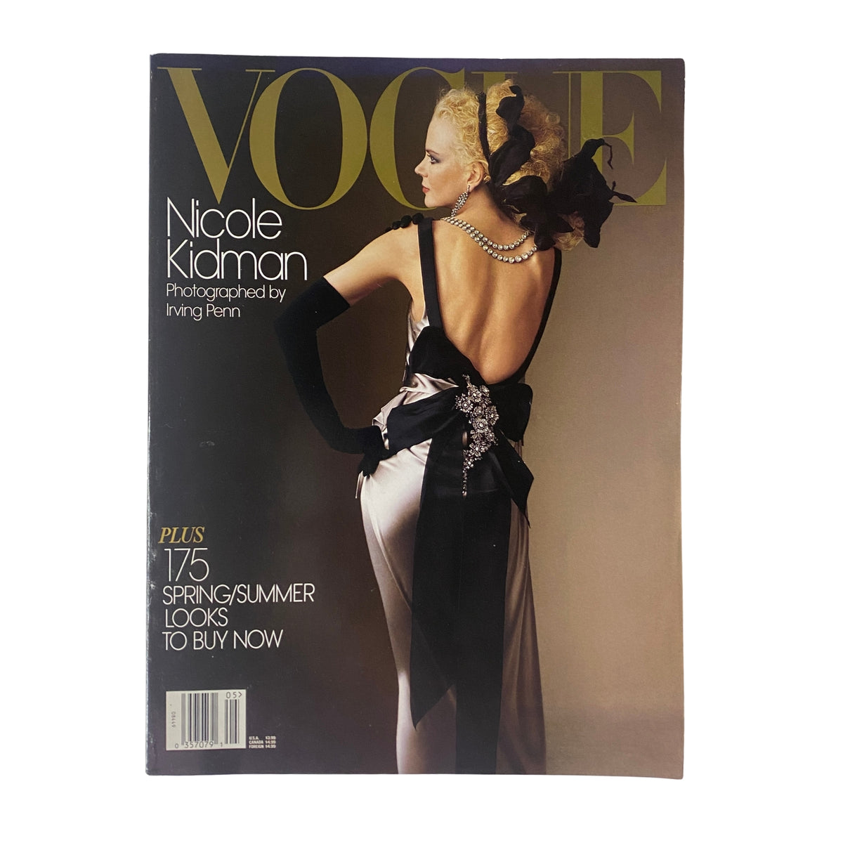 Cover of Vogue Magazine May 2004 featuring Nicole Kidman, photographed by Irving Penn, showcasing high fashion with dramatic styling.
