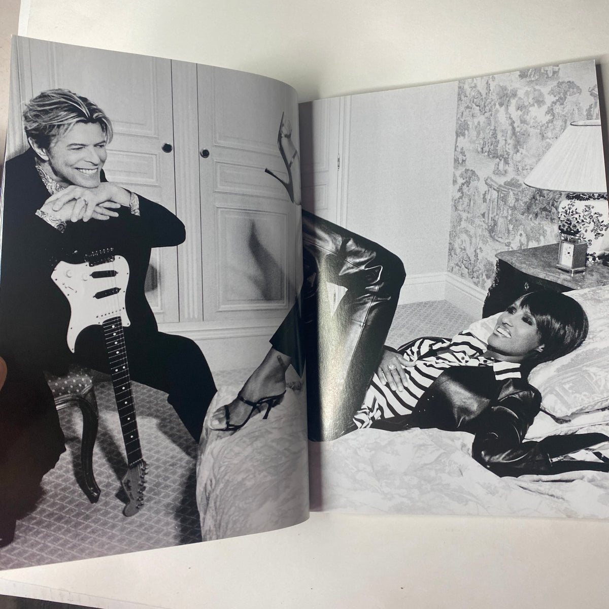 Spread in Vogue Magazine May 2004 featuring David Bowie and a model, highlighting a stylish black and white editorial photo.