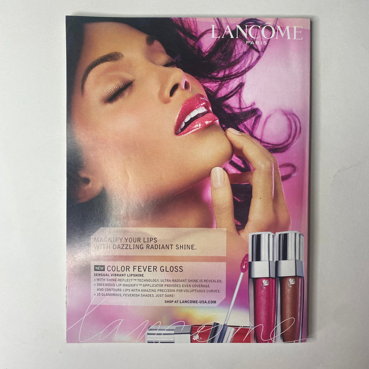 Vogue Magazine January 2007 promotional image for Lancôme, showcasing glossy lip products with the tagline 'Magnify Your Lips With Dazzling Radiant Shine,' highlighting beauty trends in the new year.