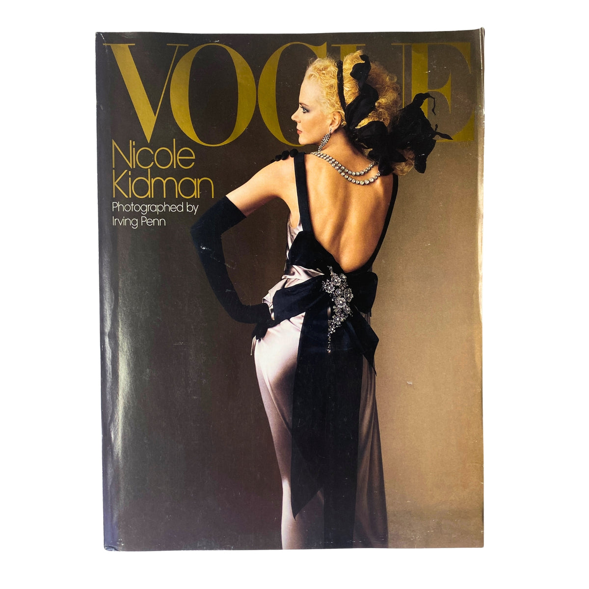 Cover of Vogue Magazine May 2004 featuring Nicole Kidman, photographed by Irving Penn, showcasing a striking portrait with a glamorous design.