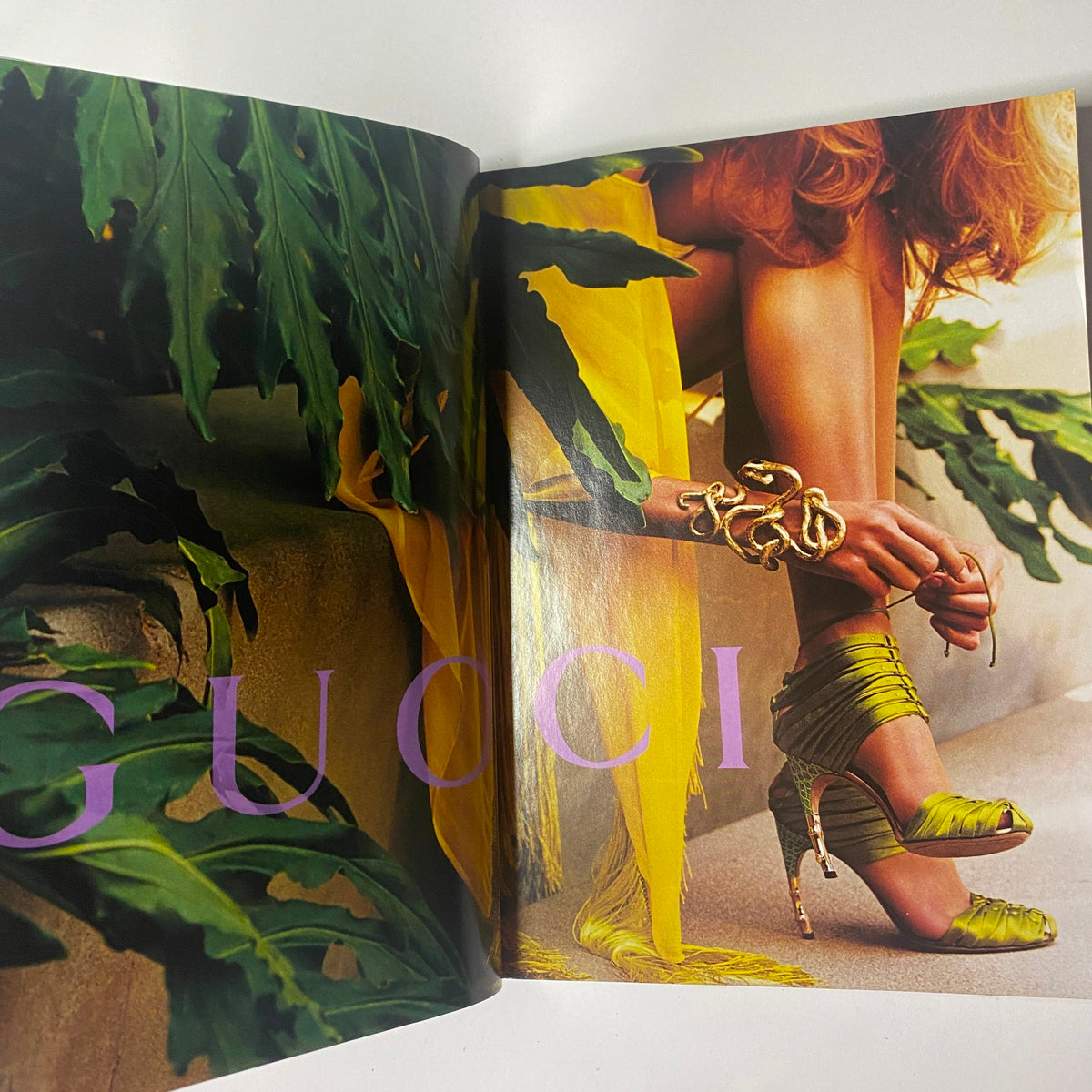 Vogue Magazine May 2004 Nicole Kidman by Irving Penn Cover No Label featuring an artistic fashion spread showcasing vibrant Gucci stilettos paired with a striking gold accessory against lush green foliage.