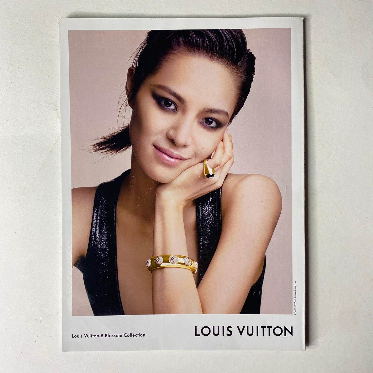 Promotional image from Vogue Magazine July 2019 highlighting the Louis Vuitton Blossom Collection, showcasing a model with elegant styling and jewelry.