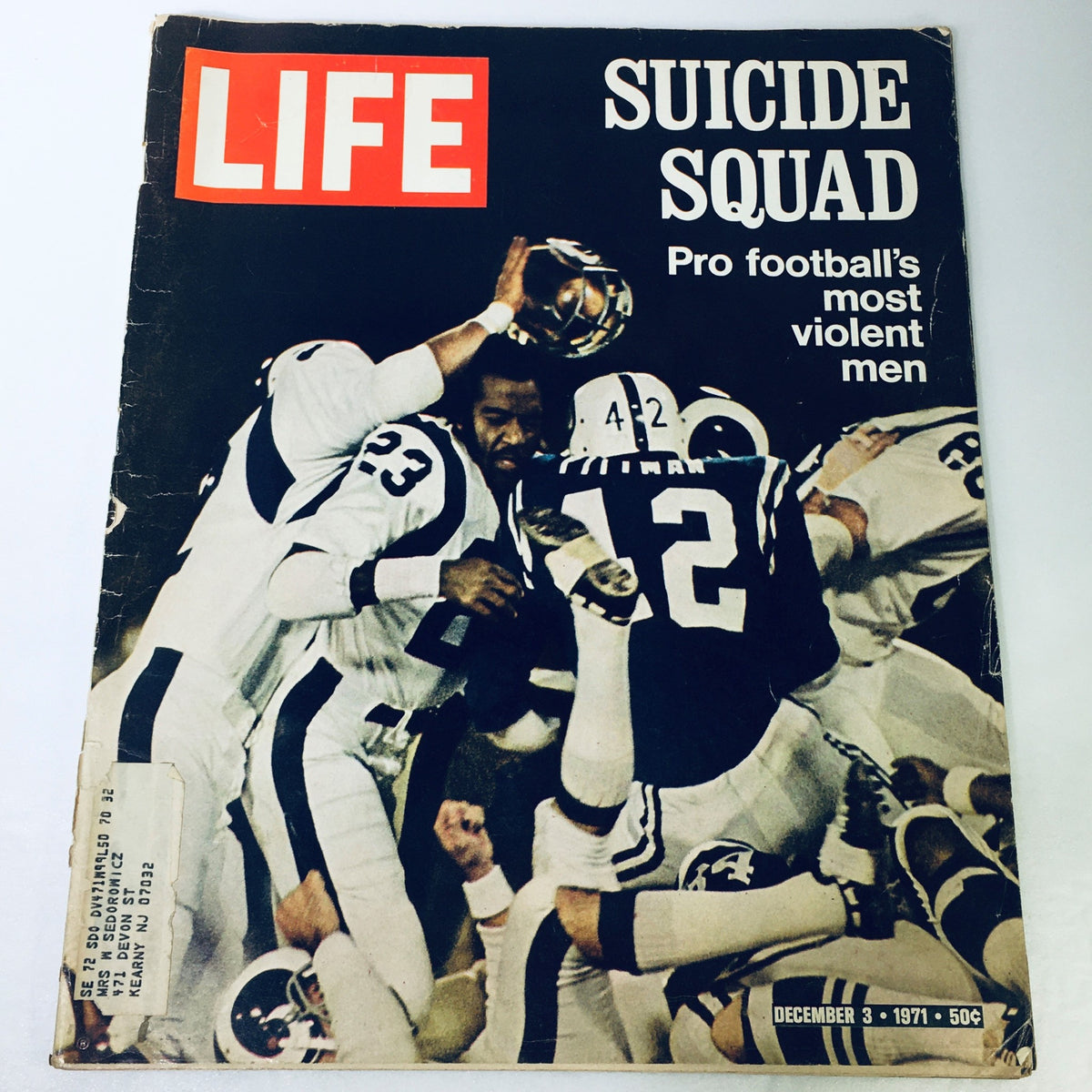 Cover of VTG Life Magazine December 3, 1971, featuring the title 'Suicide Squad: Pro Football's Violent Men', showcasing intense action from a football game.