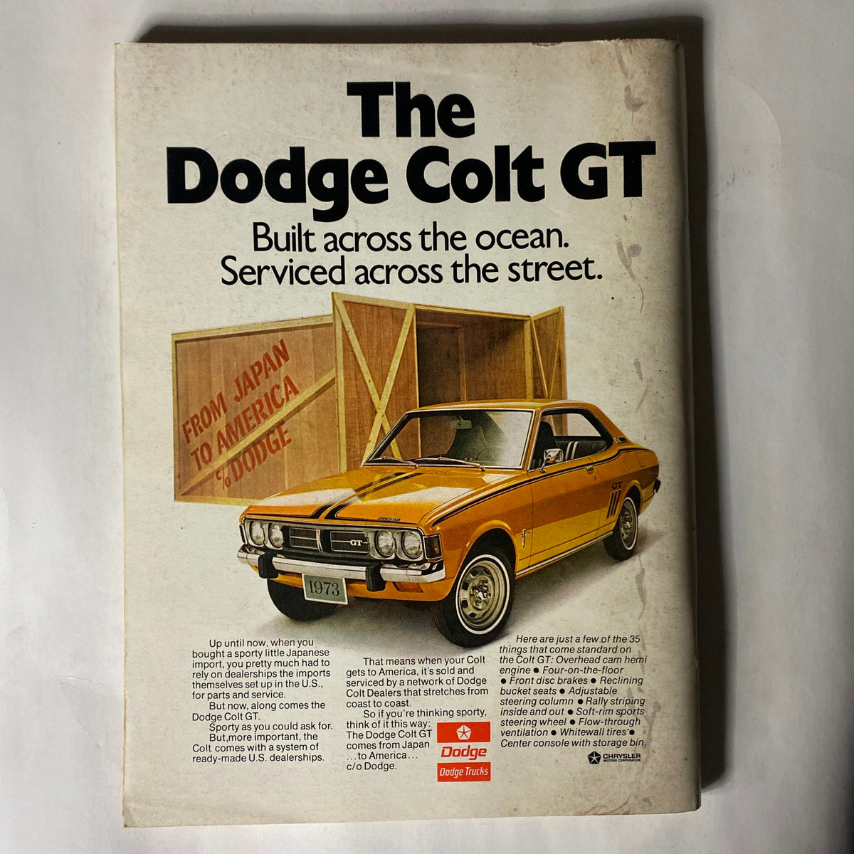 Advertisement from VTG Playboy Magazine June 1973 for the Dodge Colt GT, featuring a sporty yellow car.