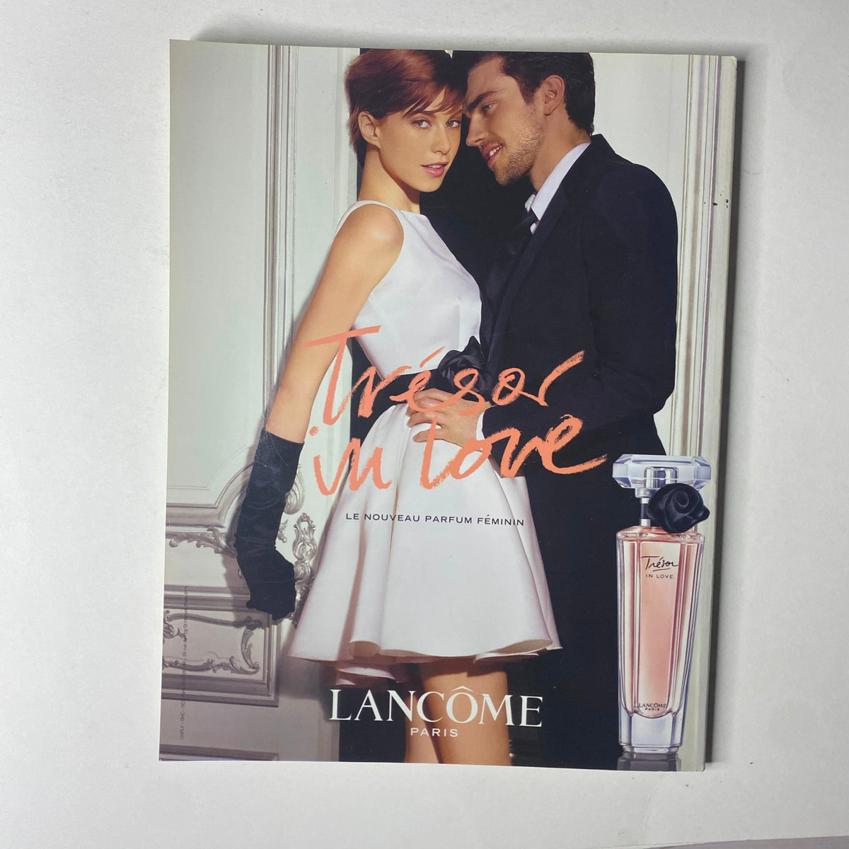 Advertisement from Vogue Paris Magazine June - July 2011 No. 918 for Lancôme's perfume, featuring a romantic couple.
