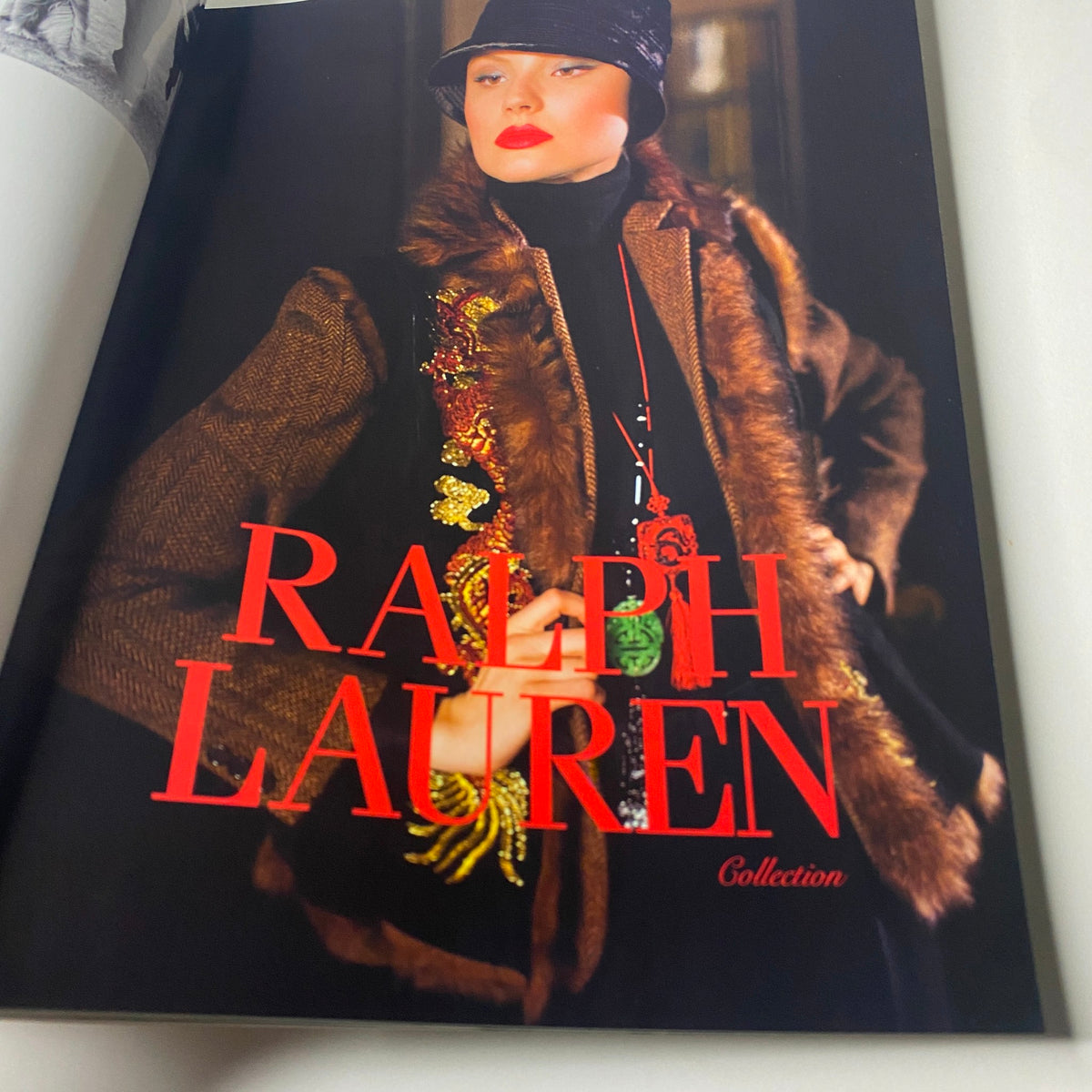 Ralph Lauren collection page from Vogue Paris Magazine, September 2011 No. 920, featuring a stylish model in a chic outfit with bold text.