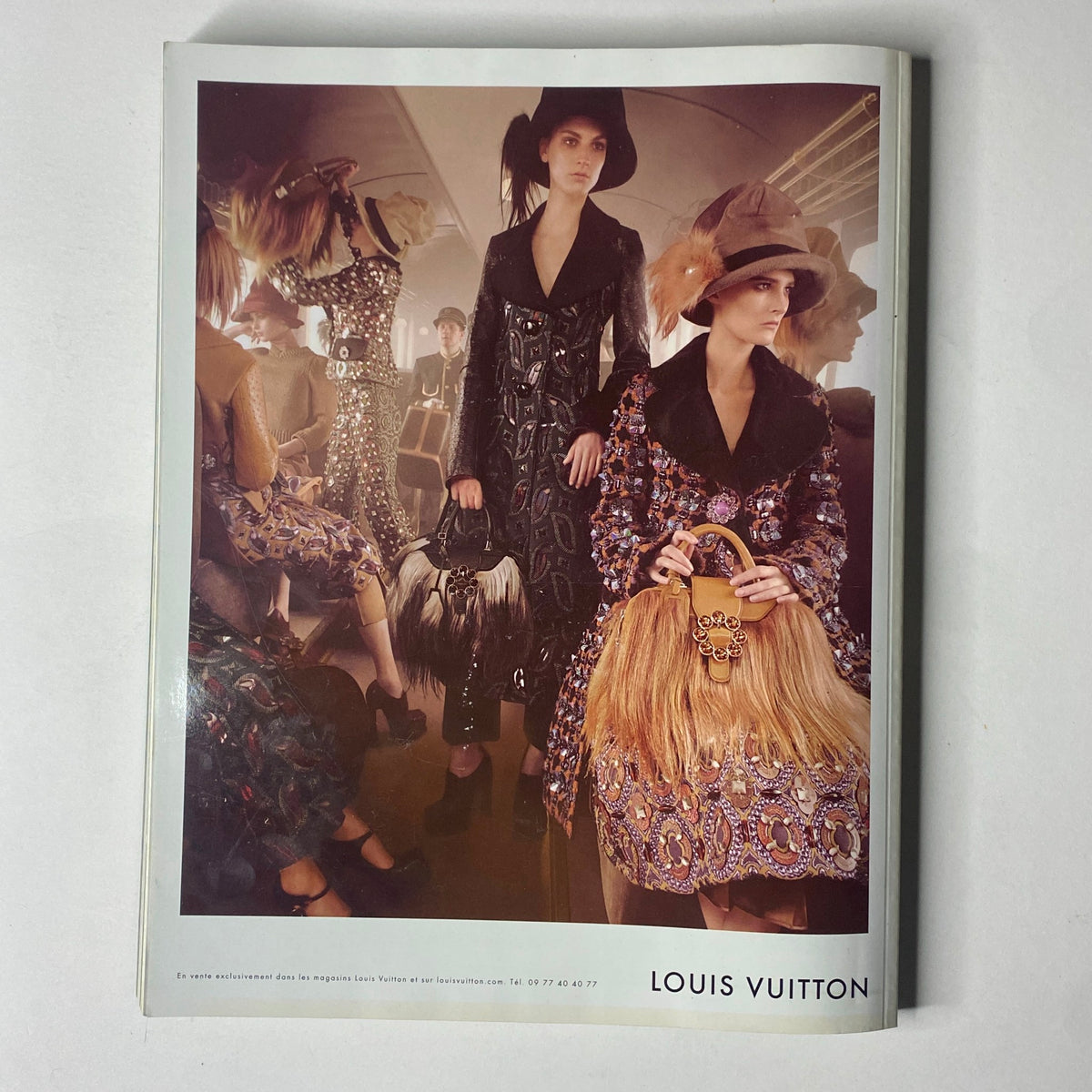 A glamorous editorial spread in Vogue Paris Magazine September 2012 highlighting Louis Vuitton's latest fashion collection, accompanied by stunning visuals. This issue features Kate Moss on the cover.
