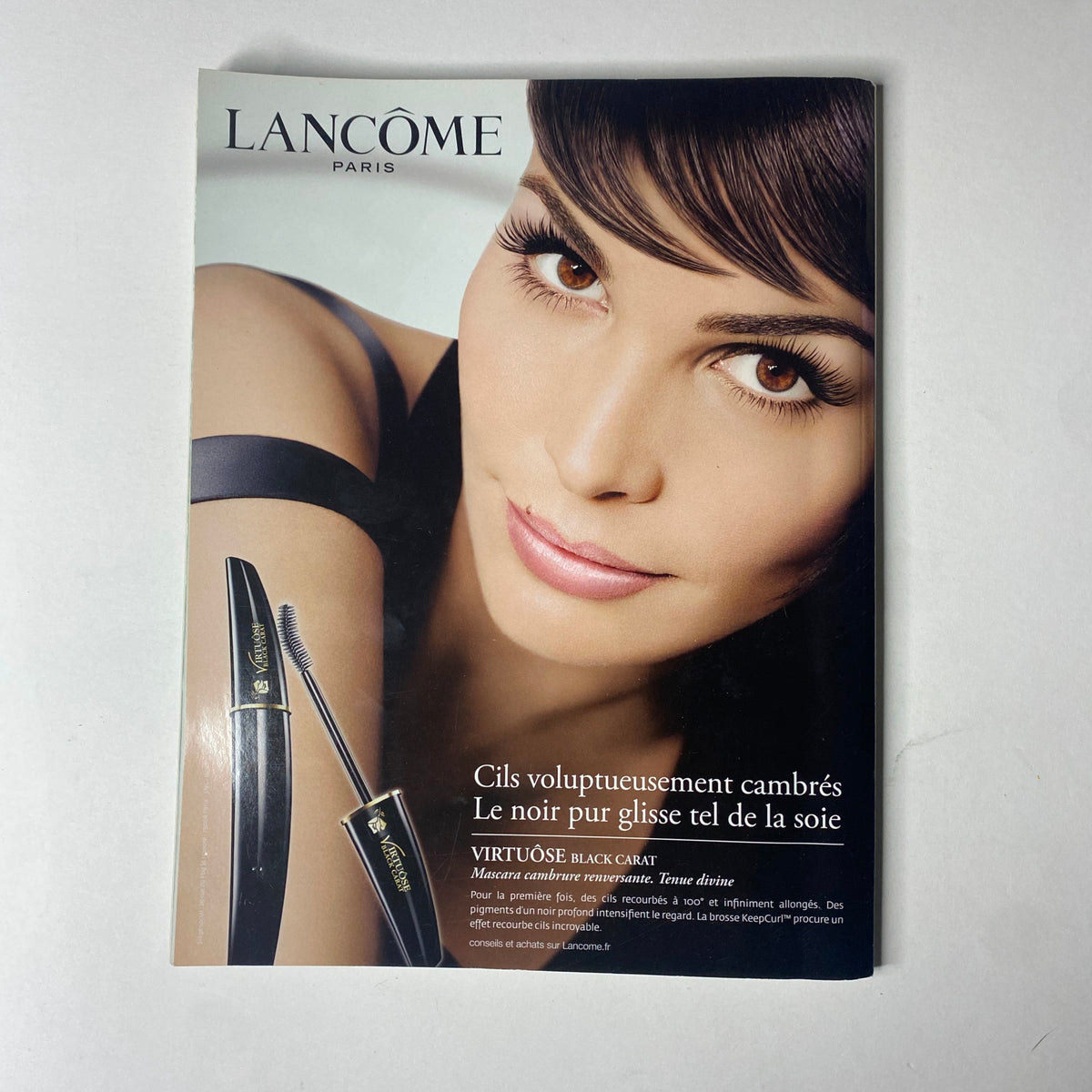 Advertisement in Vogue Paris Magazine June - July 2009 No. 898 for Lancôme beauty products, featuring a model with striking eyes.