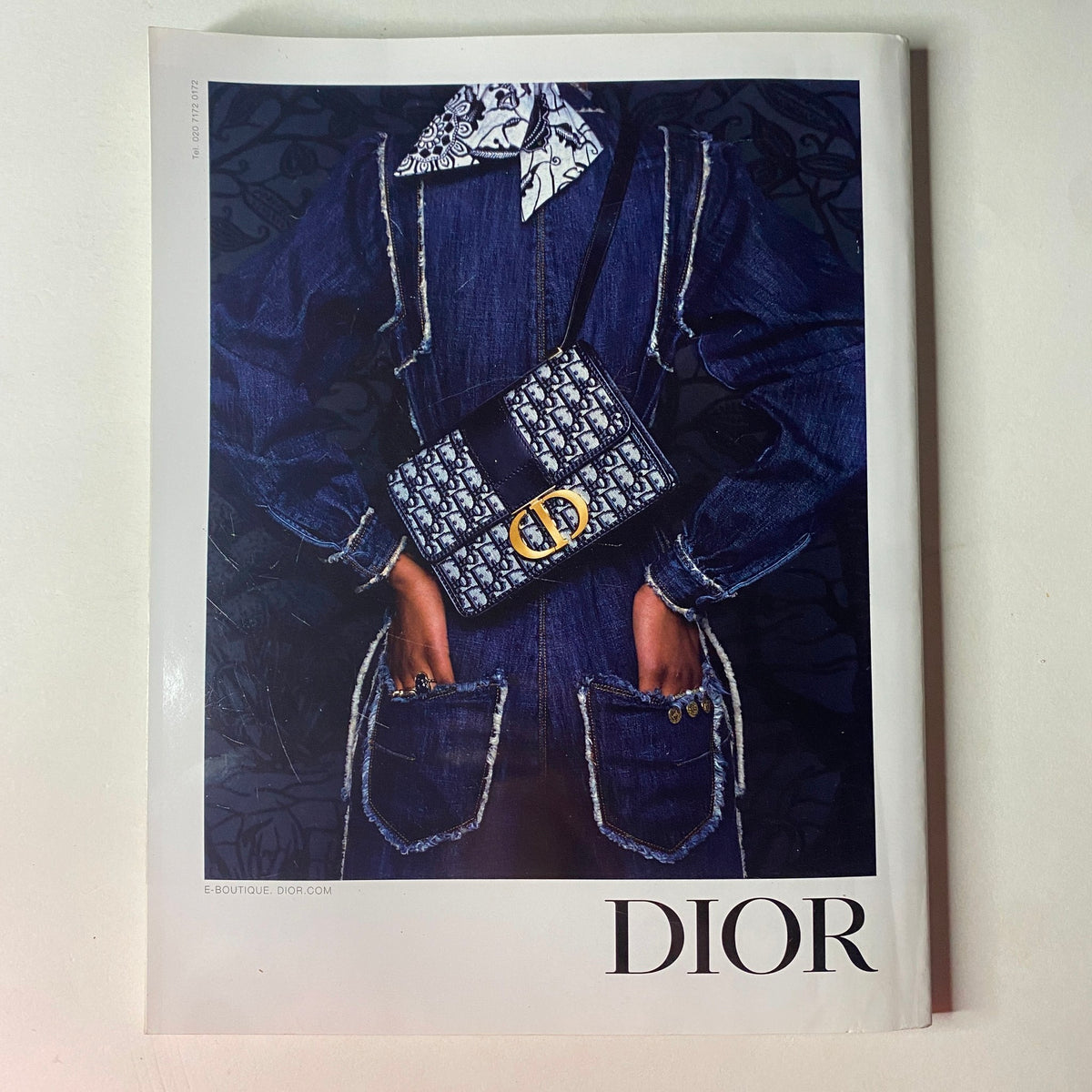 Cover of Dior magazine featuring a model wearing a stylish outfit with a prominent Dior handbag, emphasizing high fashion trends from Vogue British Magazine November 2019.