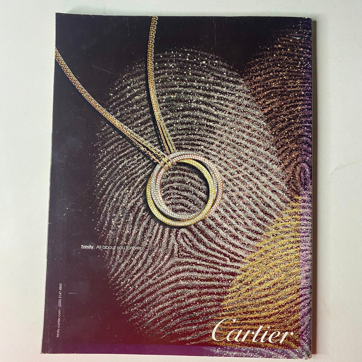 Luxury jewelry advertisement for Cartier from Vogue British Magazine June 2011, featuring a stunning necklace design.