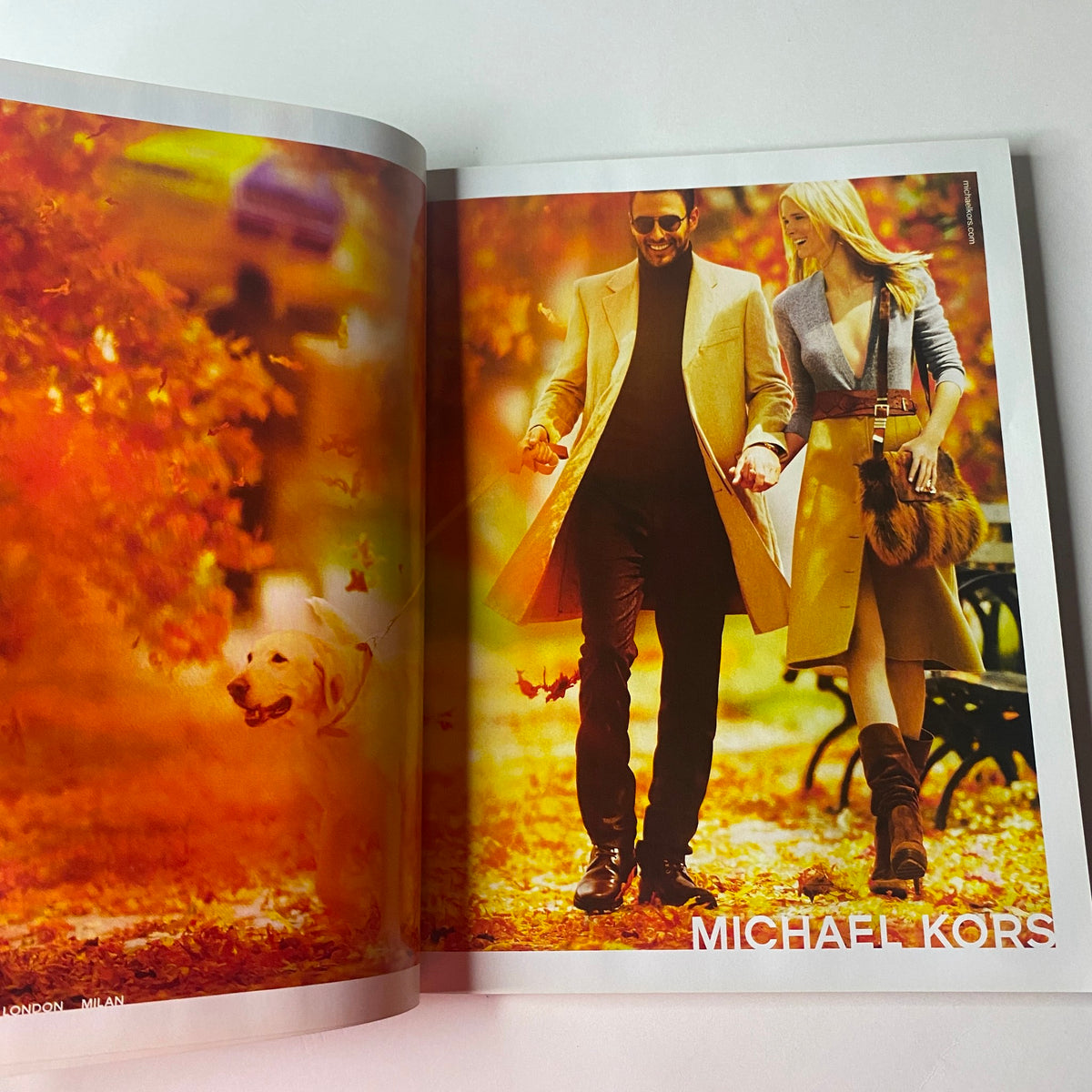 Fashion spread featuring Michael Kors in the Vogue British Magazine September 2010. Captures a stylish couple in an autumn setting, showcasing seasonal fashion.