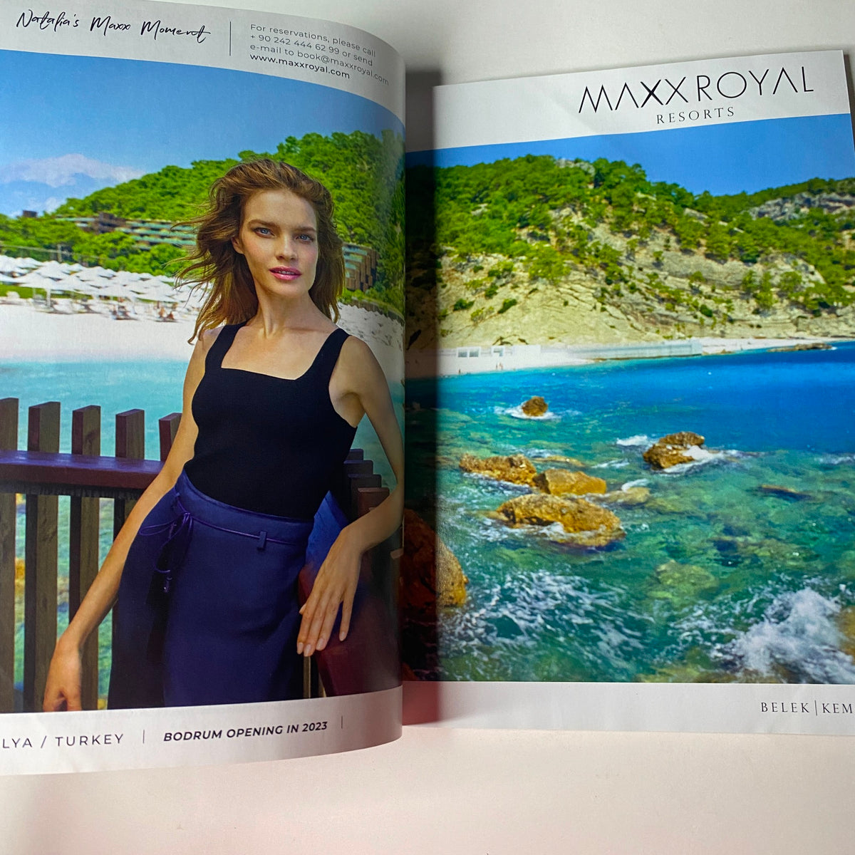 Advertisement spread in Vogue British Magazine May 2022 for Maxx Royal Resorts, featuring a model on a scenic beach backdrop.