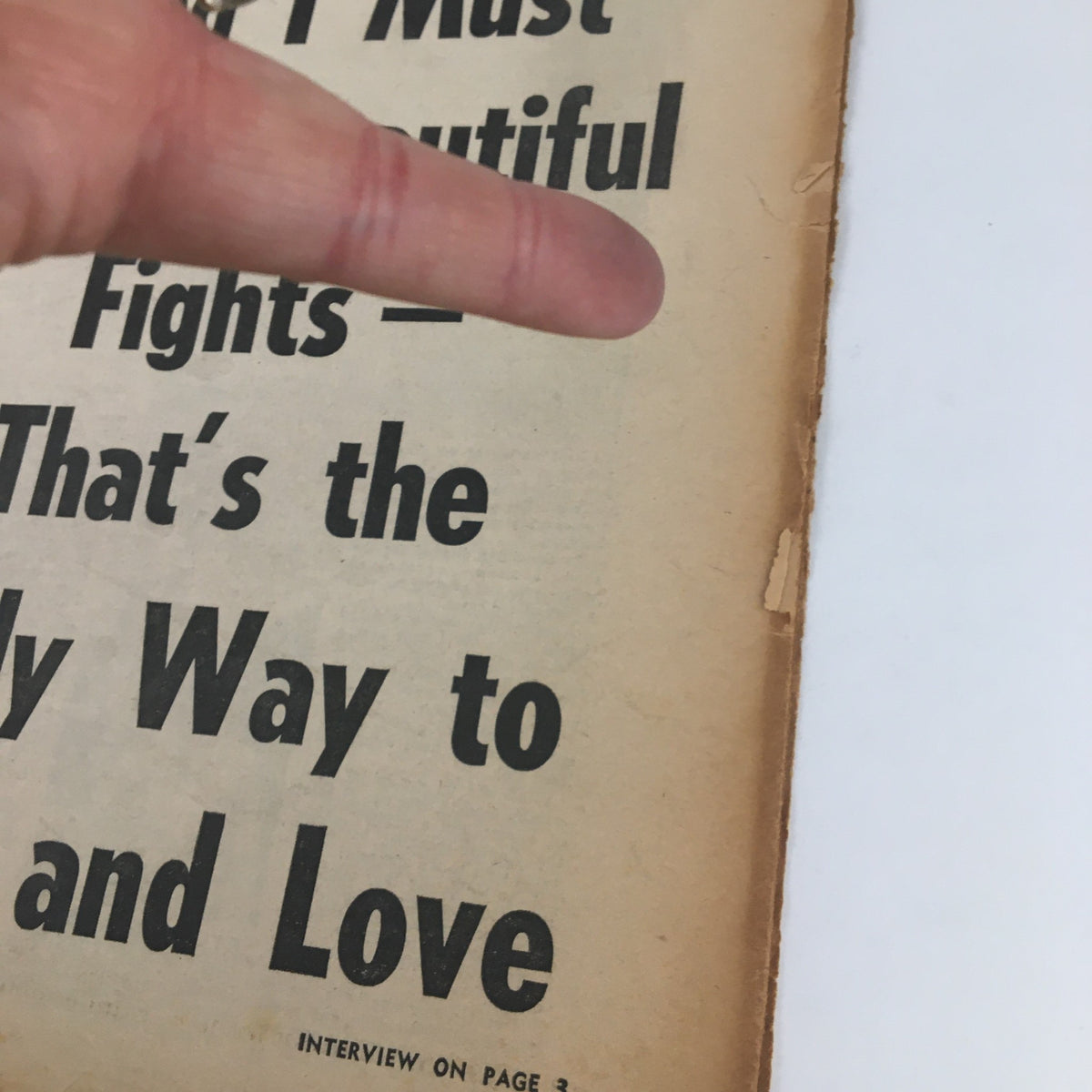 Detailed view of the National Enquirer Newspaper January 3, 1960 showing text about marriage and love beneath Giorgia Moll's warning to suitors.
