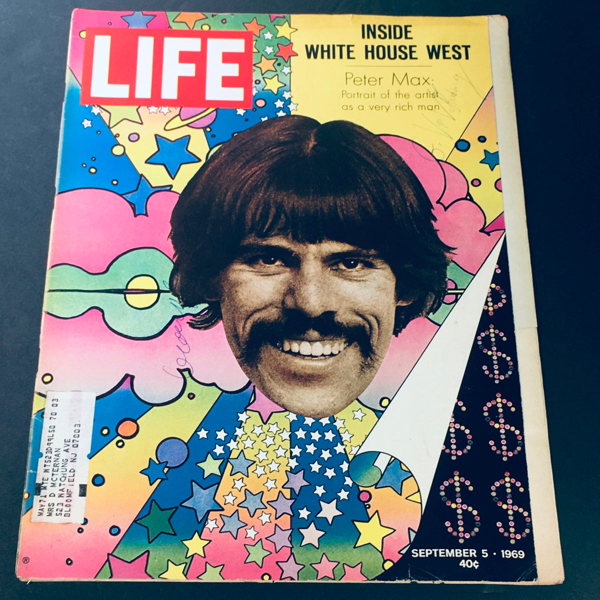 Vintage Life Magazine from September 5, 1969 featuring a colorful cover with a portrait of the rich man artist Peter Max, showcasing vibrant psychedelic art of the era.