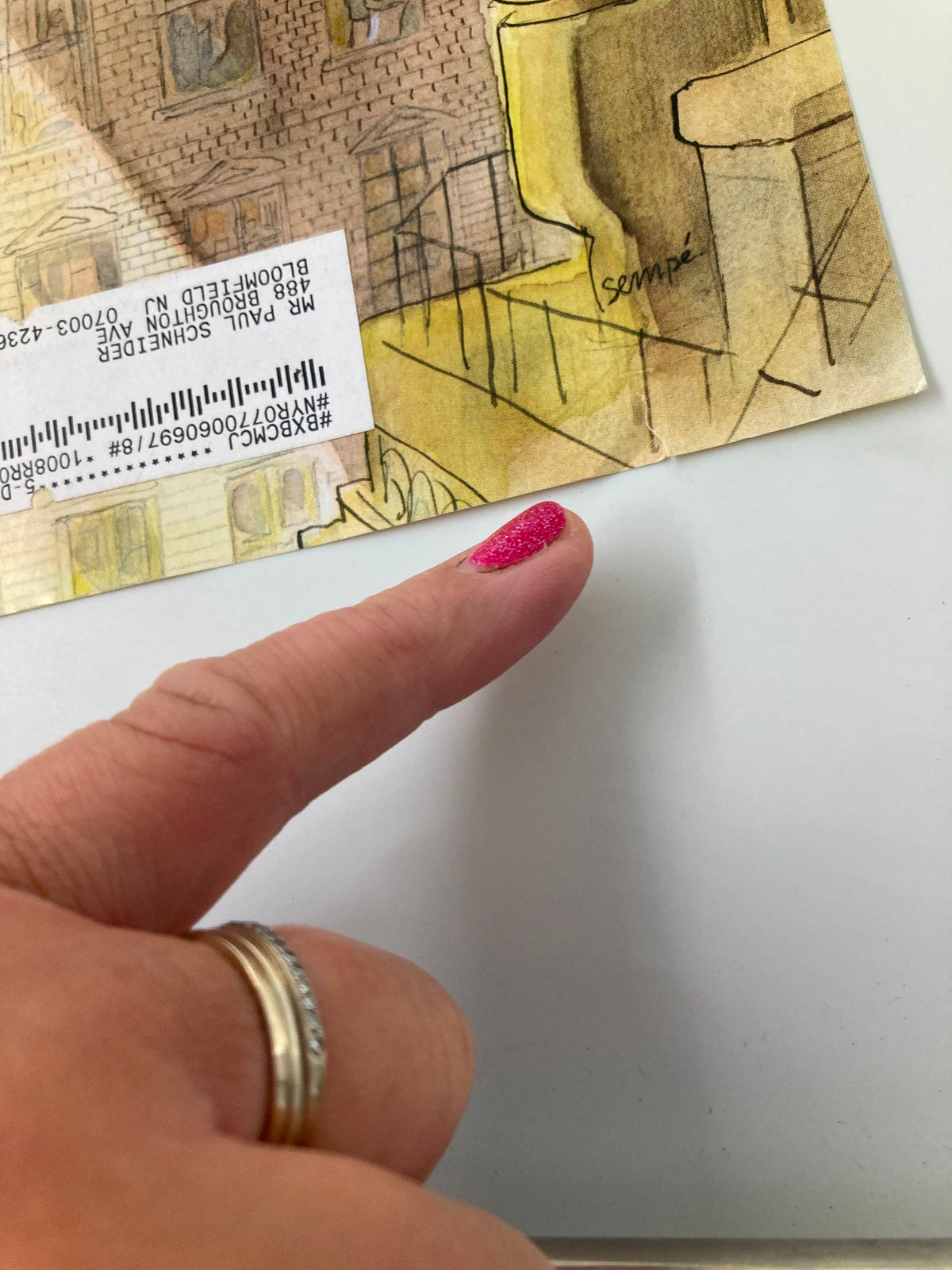 Close-up detail of the cover of The New Yorker March 21 2011 'On His Way' by Jean-Jacques Sempe, showing a small rip and highlighting the signature.