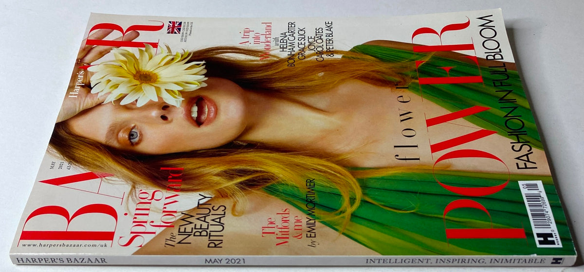 Back cover of Harper's Bazaar Magazine May 2021 with the theme 'Flower Power: Fashion in Full Bloom'. The cover features a model holding a daisy, emphasizing spring style and beauty rituals.